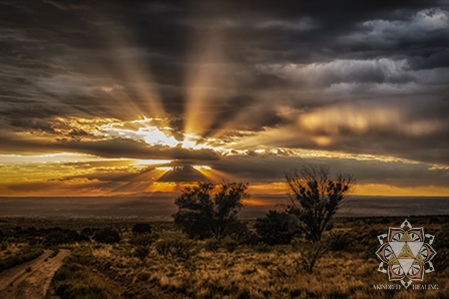 New Mexico dessert sunset with sunbeams illuminating through the clouds