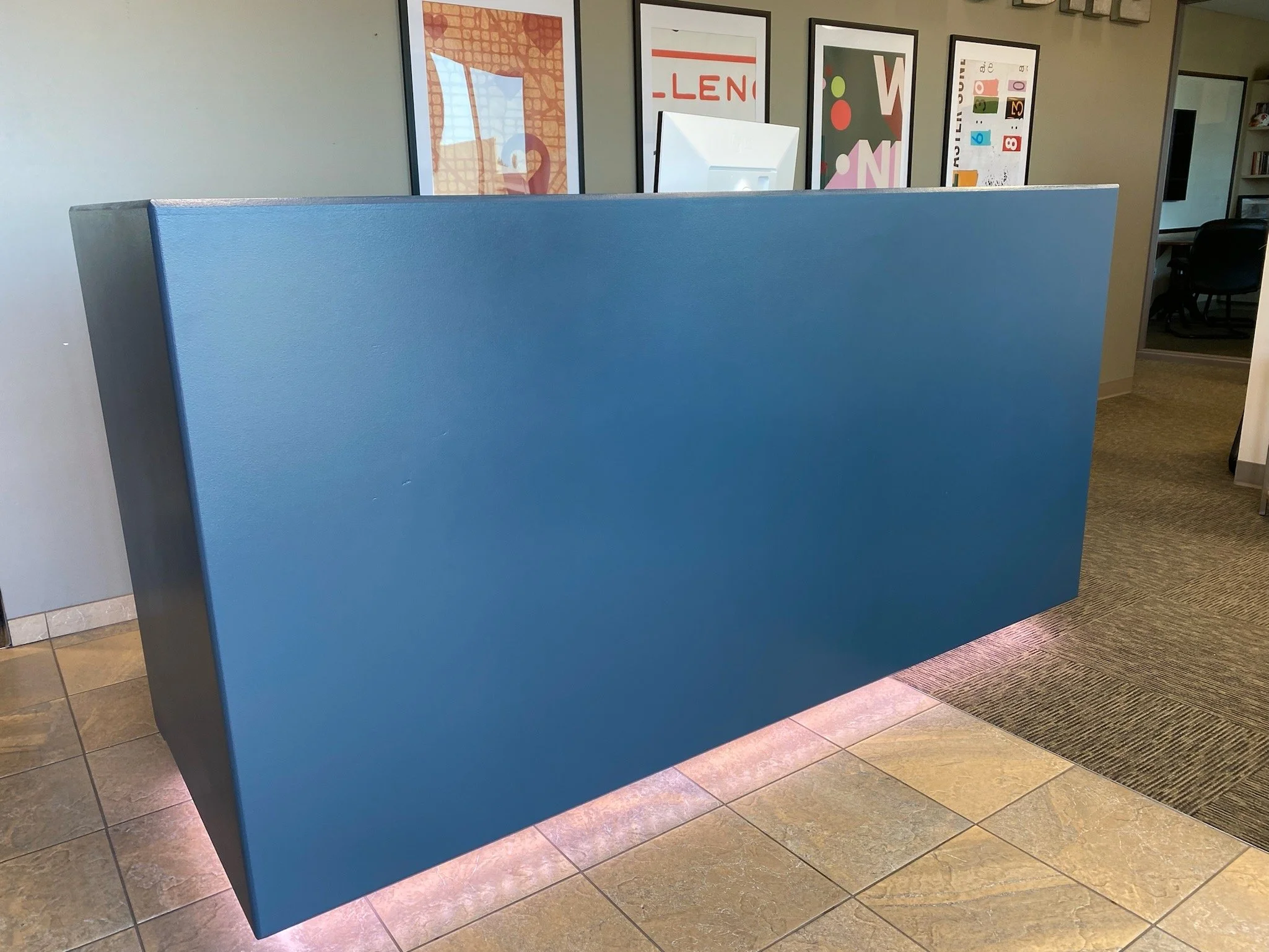 reception desk facade with lighting under toekick
