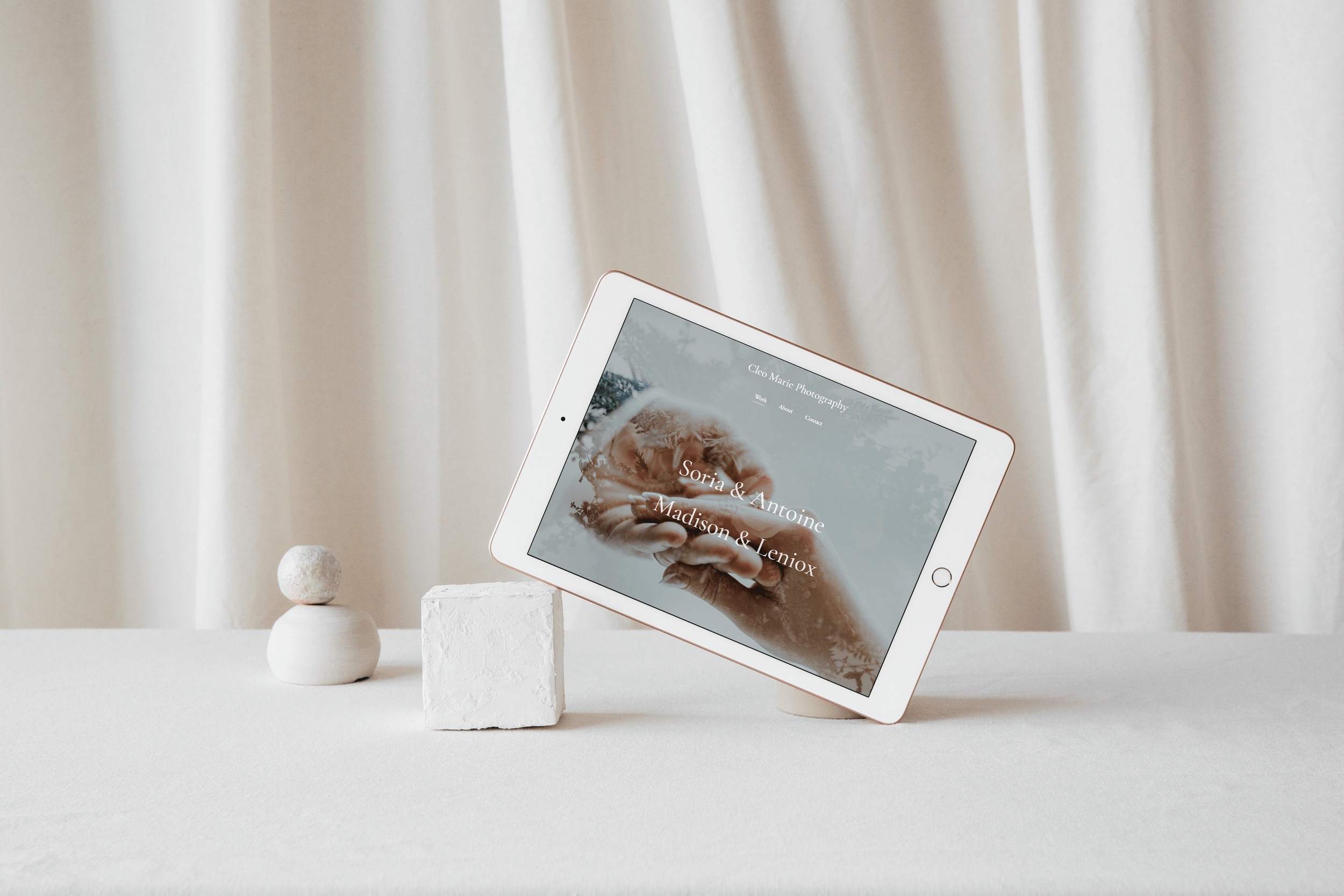 Redesignia designed website mockup on iPad in front of white curtain