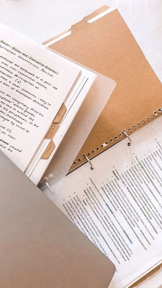 Organized real estate transaction documents and contract files prepared by a transaction coordinator for compliance and closing.