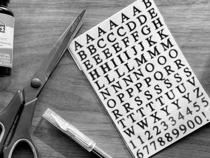 Letter stickers, scissors