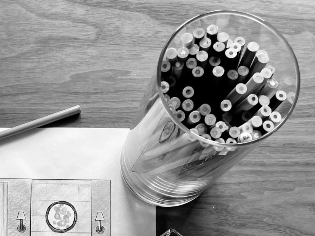 Colored pencils in glass jar