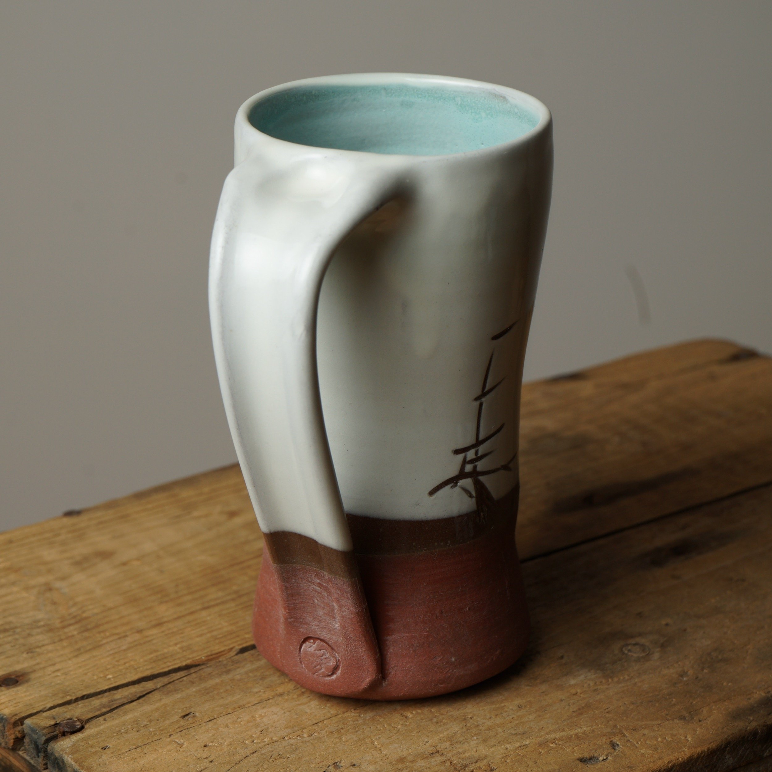 Muddy Handshake Pottery tall white aqua windswept pine mug1.jpeg