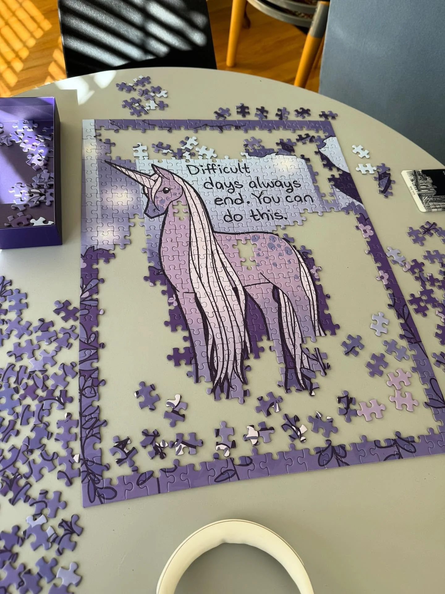 This is as far as I got with my somber purple unicorn puzzle from #TheLatestKate before it was time to pack up and go home. The text reads: “Difficult days always end. You can do this.“ It’s comforting to keep dropping down into dee