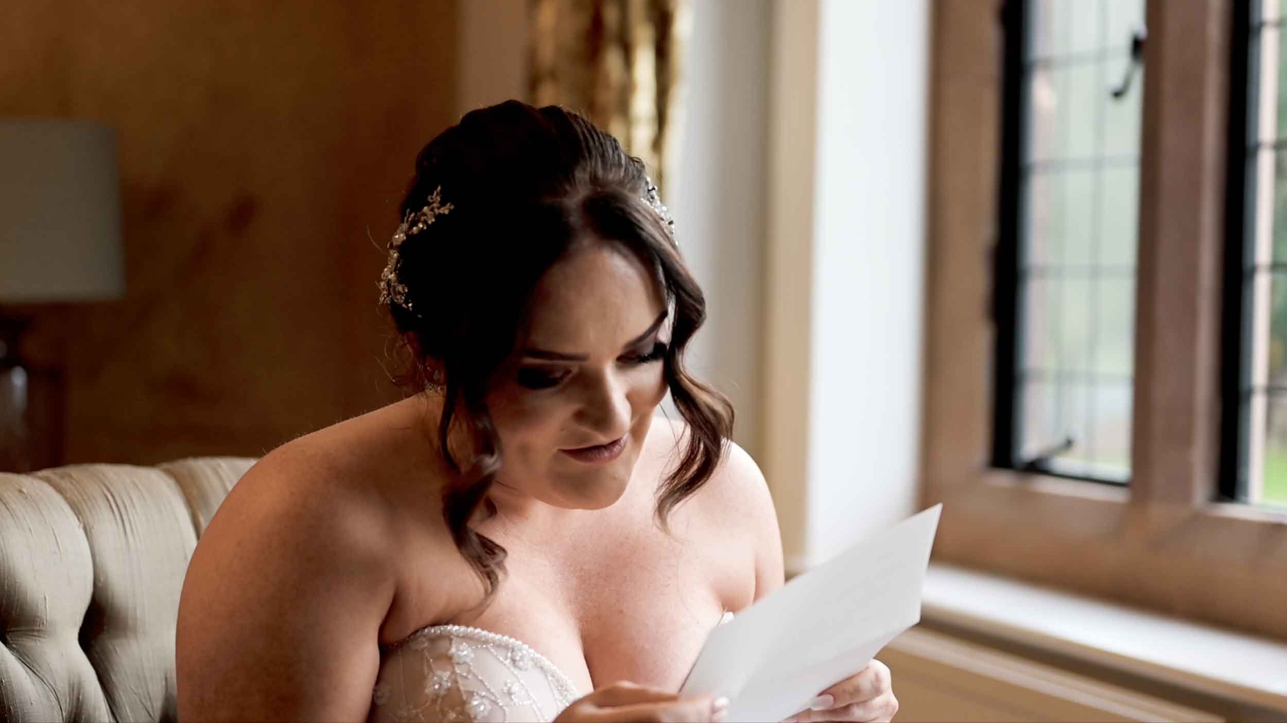 Bride reading her groom's love letter