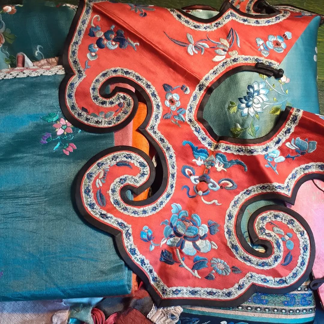 I have been given custody of even more lucky bats!
When my father said that he was bringing me my grandfather's Chinese baby clothes I didn't imagine they were going to be so colourful or so beautifully embroidered. Tiny exquisite collars, a jacket a