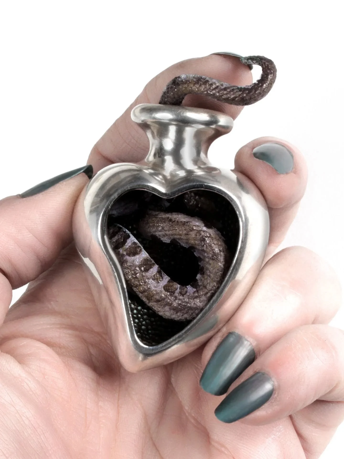 Sin in My Heart [1]
Luckily digital photos have a timestamp, or I'd be struggling to place this...it's 2018. 
I've been teaching wax carving for more than 15 years, which sort of lead me to carve (and cast) pieces that were outside of my usual repert