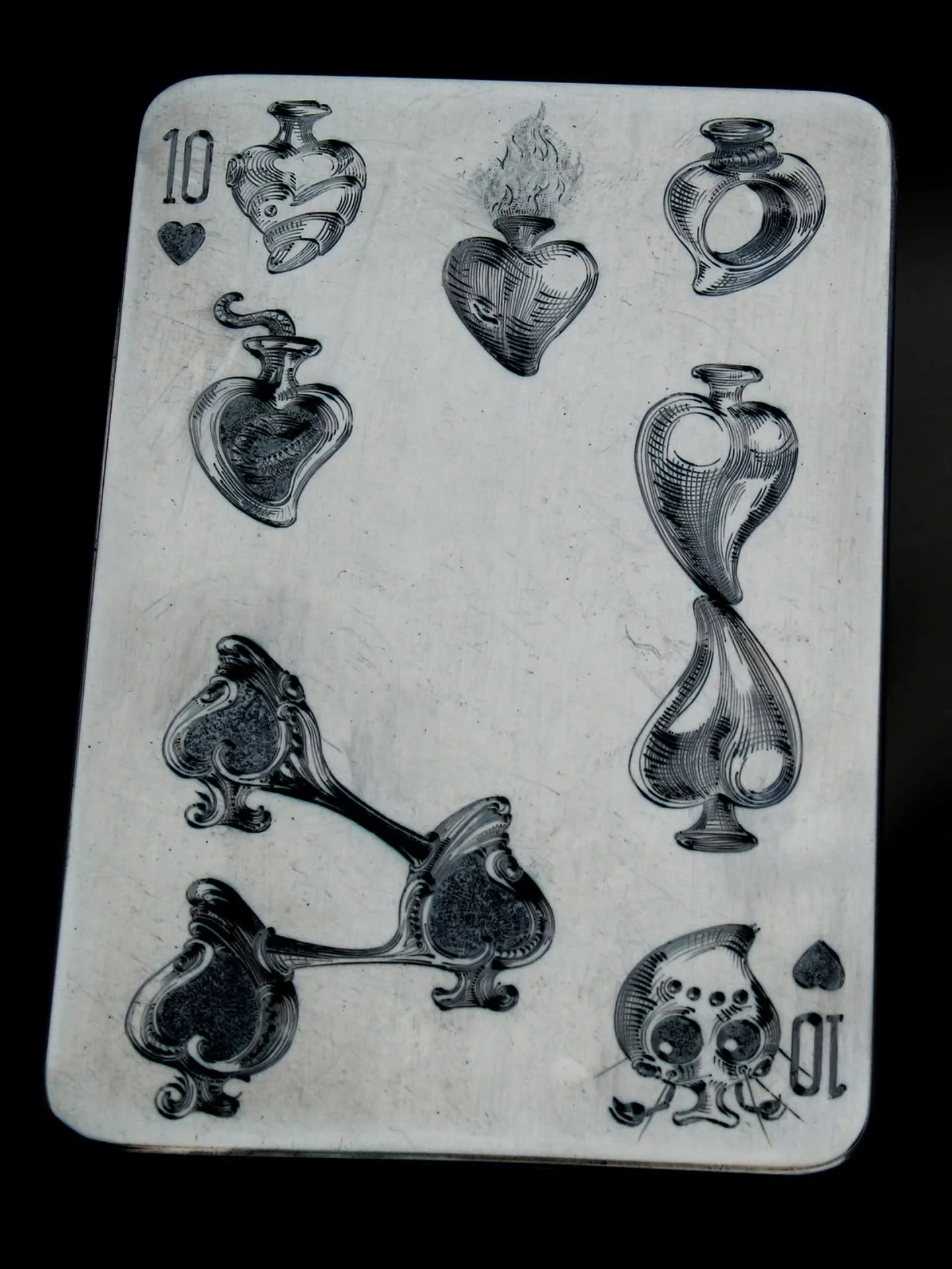 This is #TenOfHearts.
Hopefully all the recent heart-based groundwork makes more sense now!
.
Engraved plates for printing need to be a mirror image in order for text to appear the right way. 
This [1] is a photoshopped negative, mirrored version of 