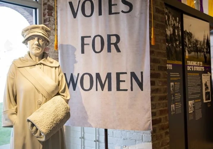 Dora Lewis and banner.JPG