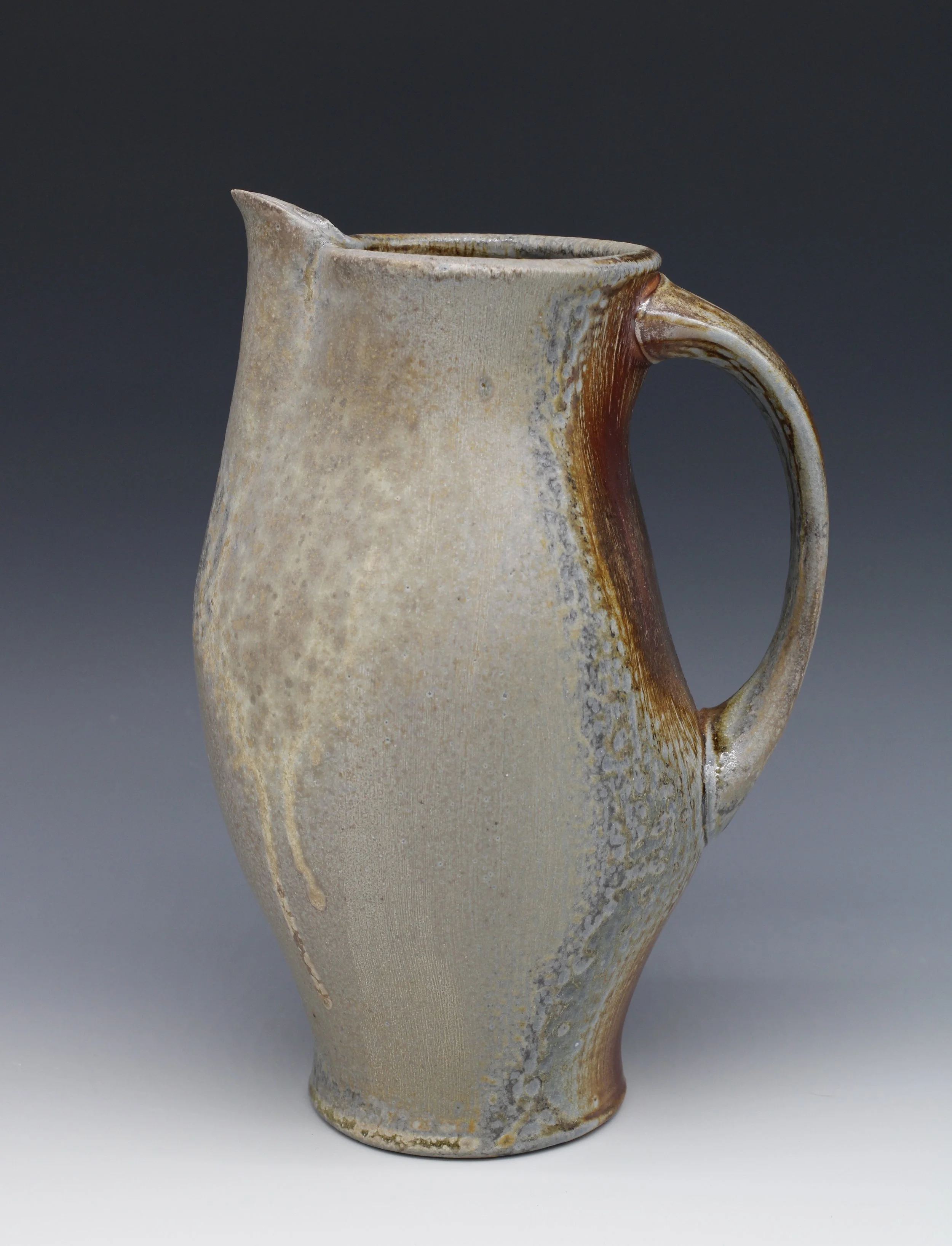  Pitcher  
Shawn O'Connor, Virginia, 2020, Stoneware, wood fired, 9.1/2 in x 6.1/2 in x 5 in, 
$130