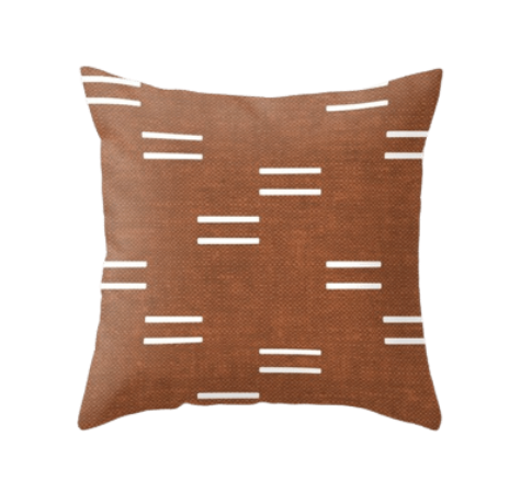 Rust and white throw pillow