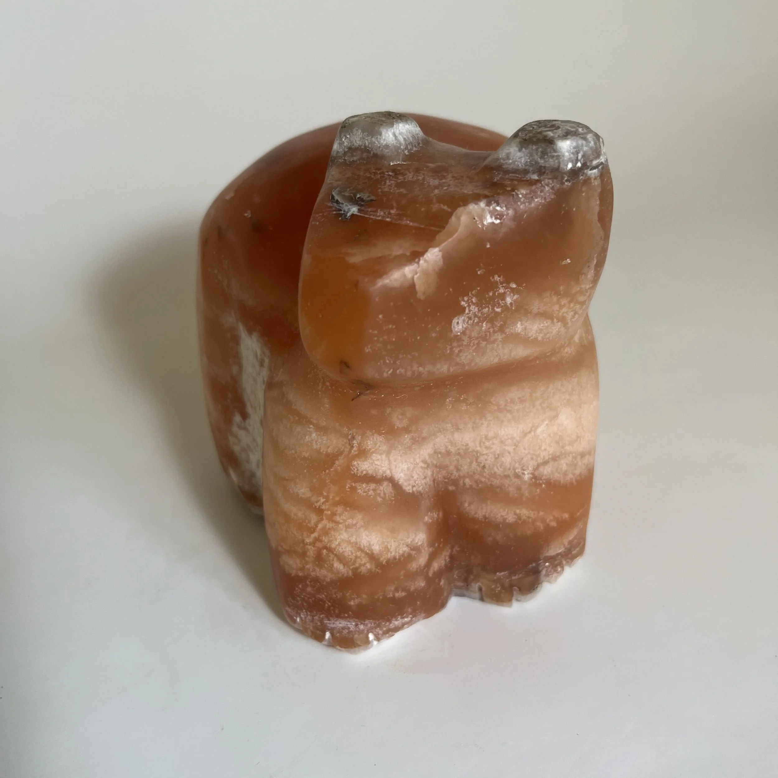 A carving of a bear from brown alabaster