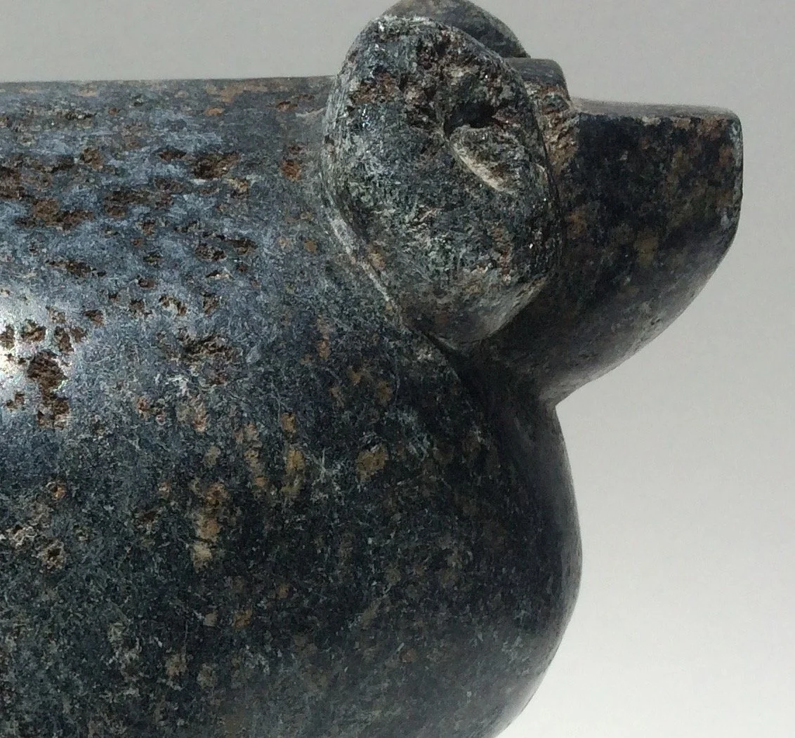 Detail: head of big horn ram carved from green soapstone.