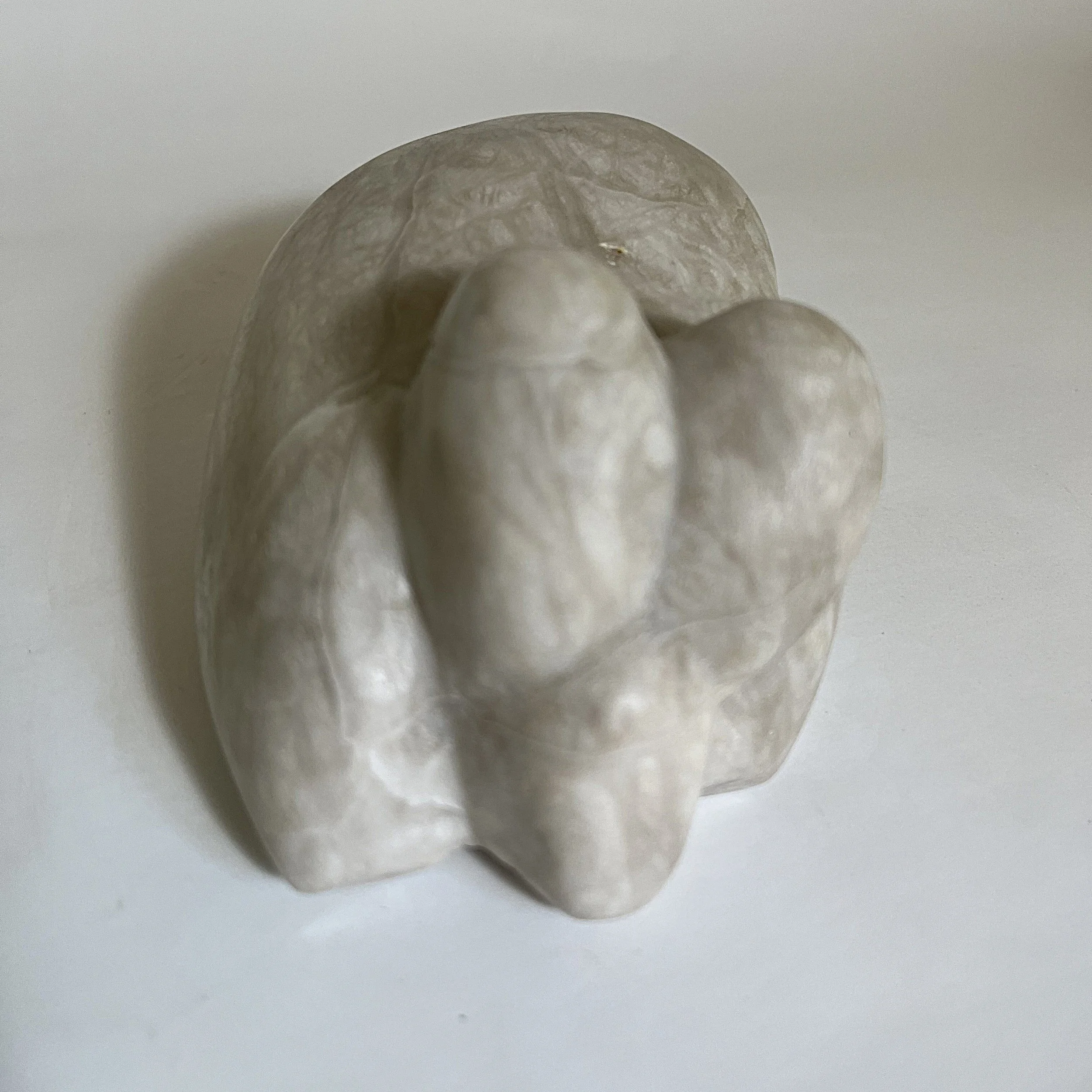 a talc sculpture of a fat rabbit