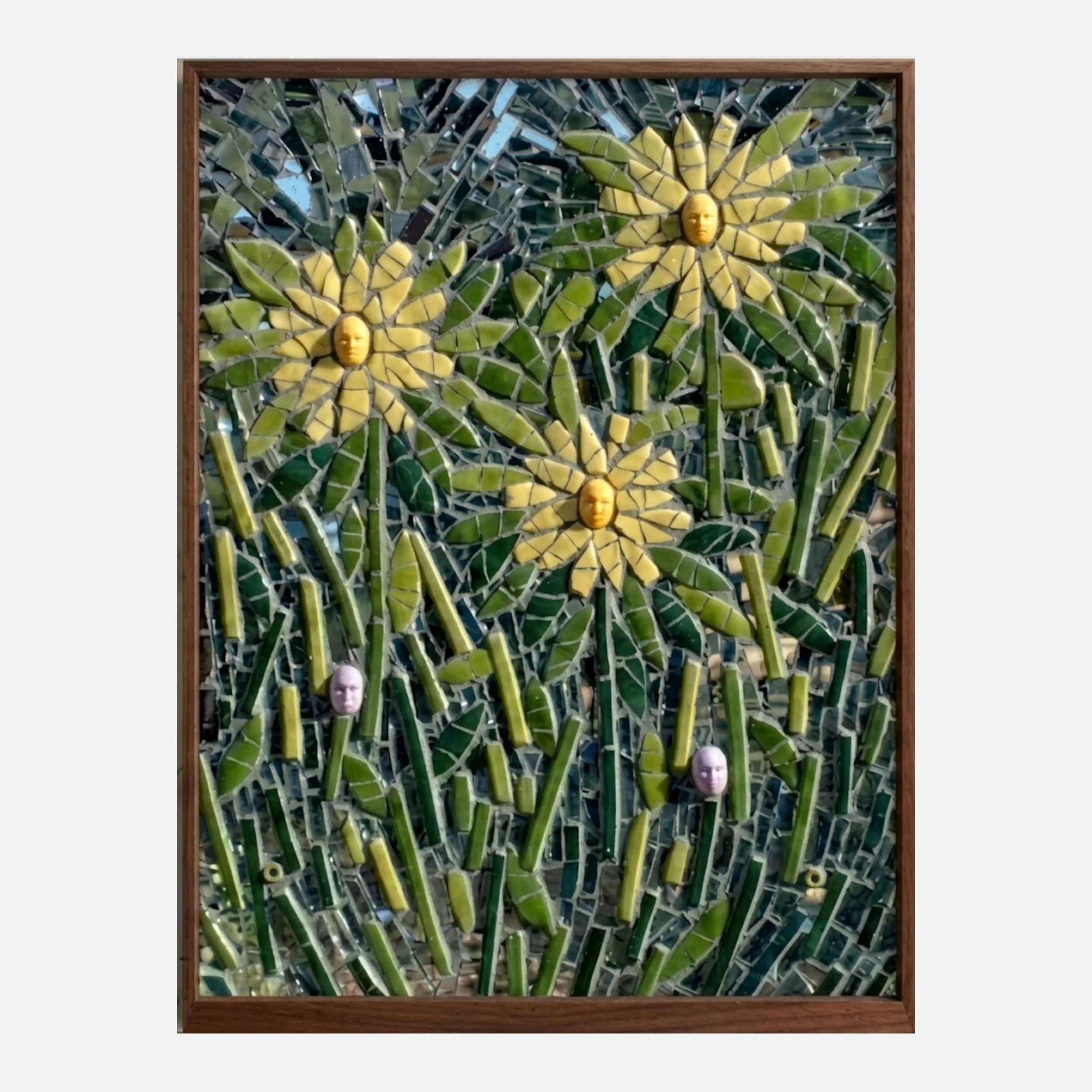 A rectangle, wood framed, mosaic of sunflowers with human faces as their pistils.