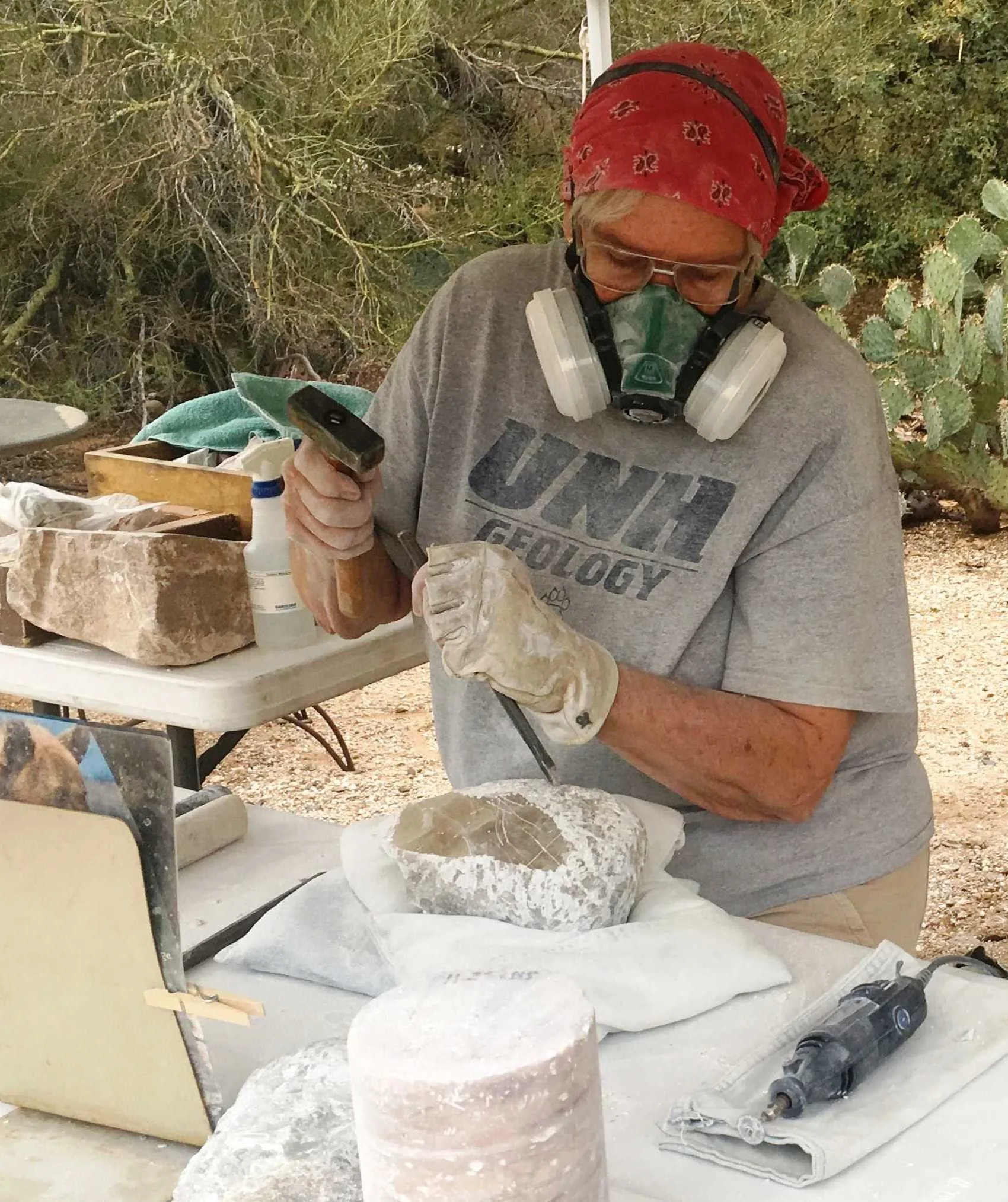 Ellen wearing a double canister mask for stone carving