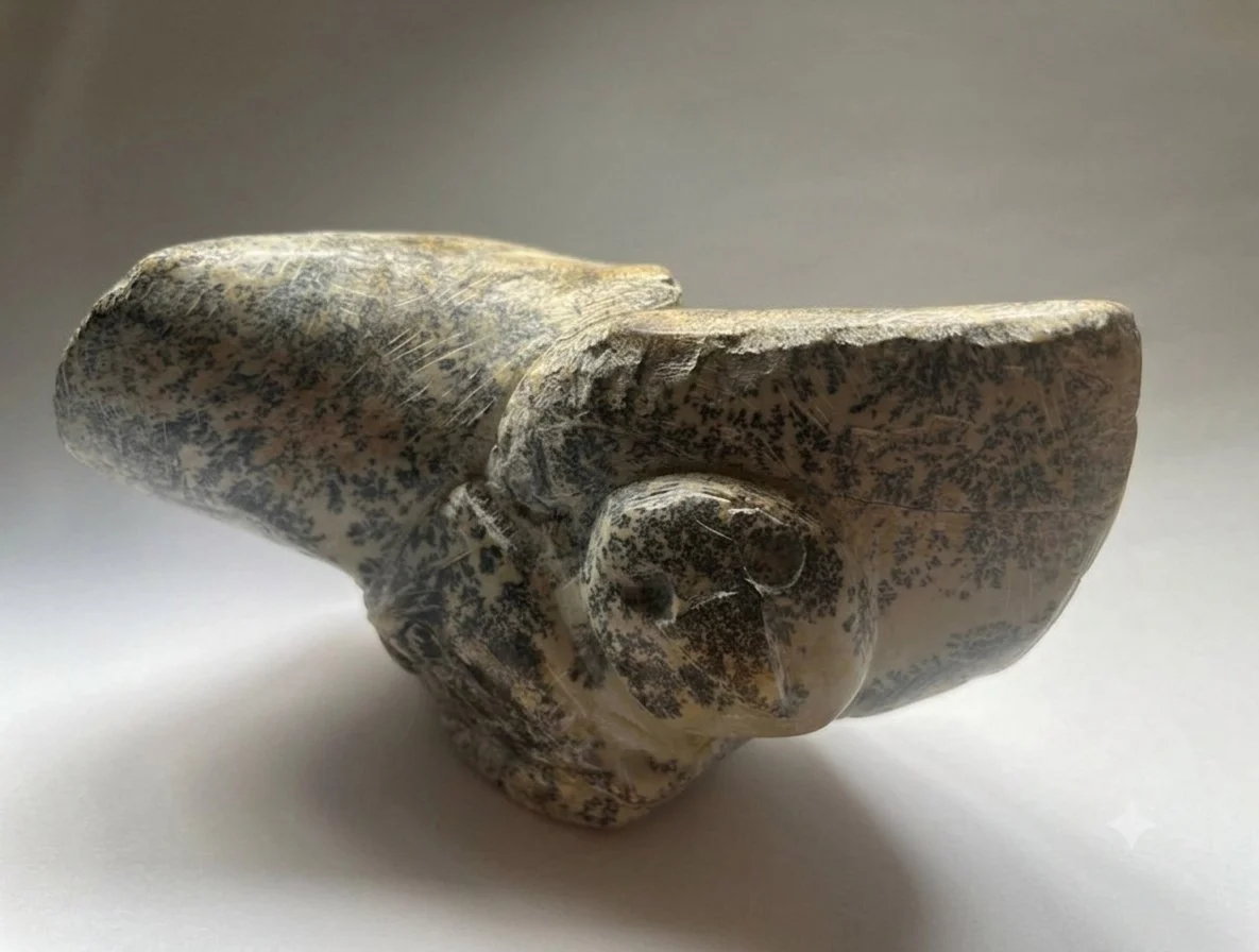 Soapstone carved as an abstract owl in flight