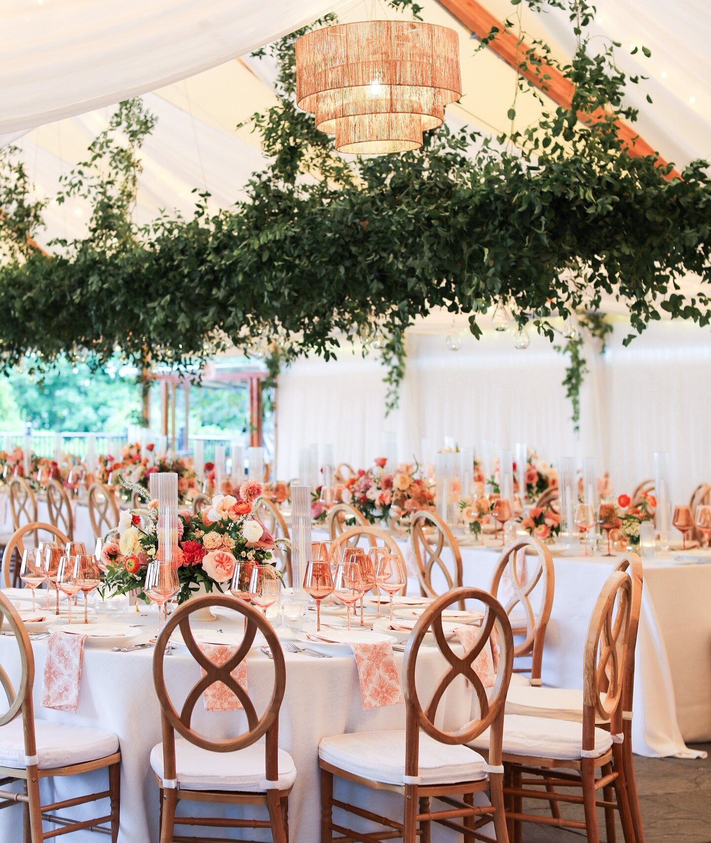 You would never know that hours before this photo was taken, this tent was just a blank canvas waiting to shine! Draping, lighting, florals, linens&hellip;it all comes together to create a one-of-a-kind wedding that always  leaves guests speechless. 