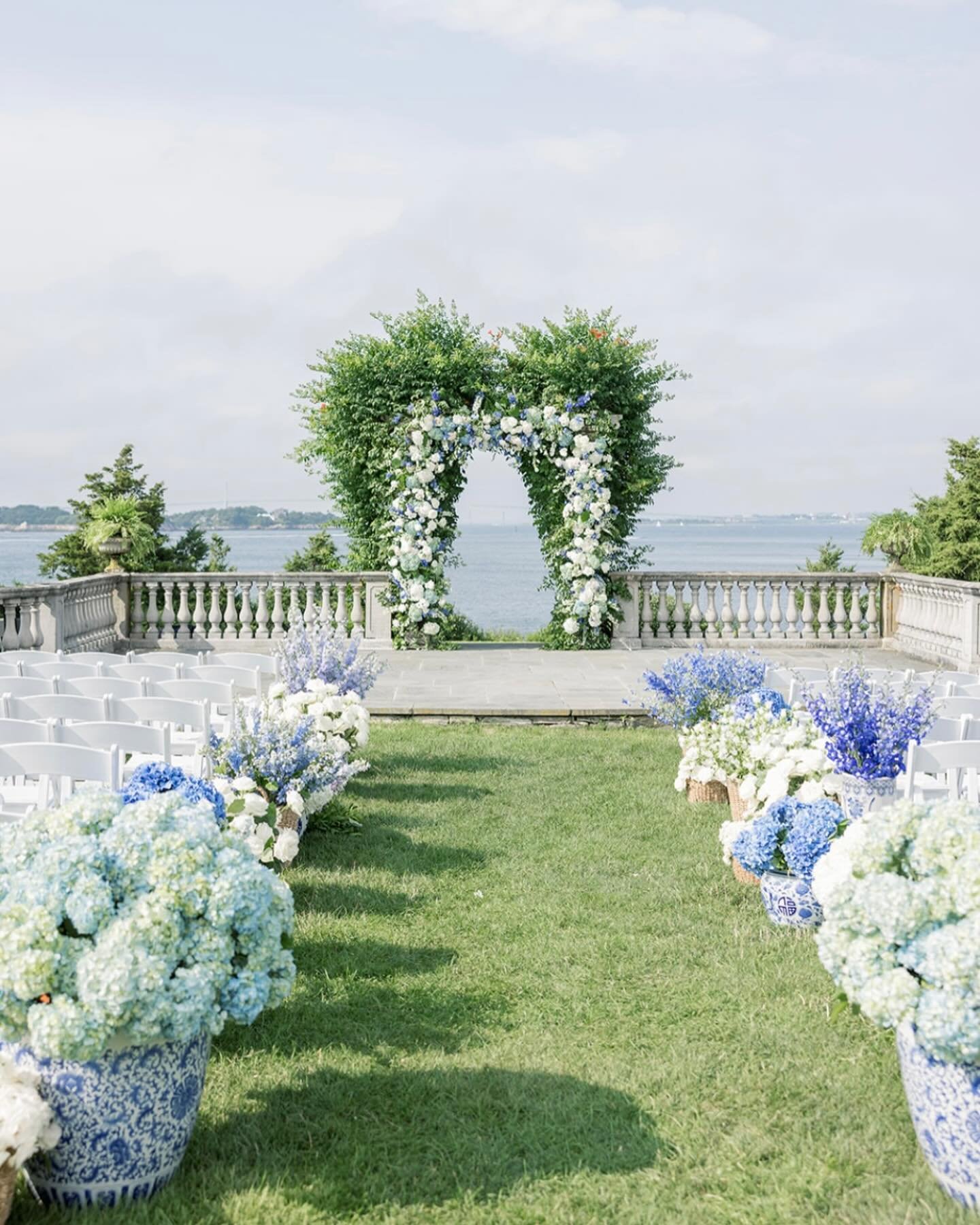 Lauren and Shayne&rsquo;s quintessential Newport wedding was a vision of coastal elegance, adorned with hues of serene blue echoing the ocean&rsquo;s beauty. The ambiance was set with clouds of hydrangea and tablescapes that boasted a romantic array 