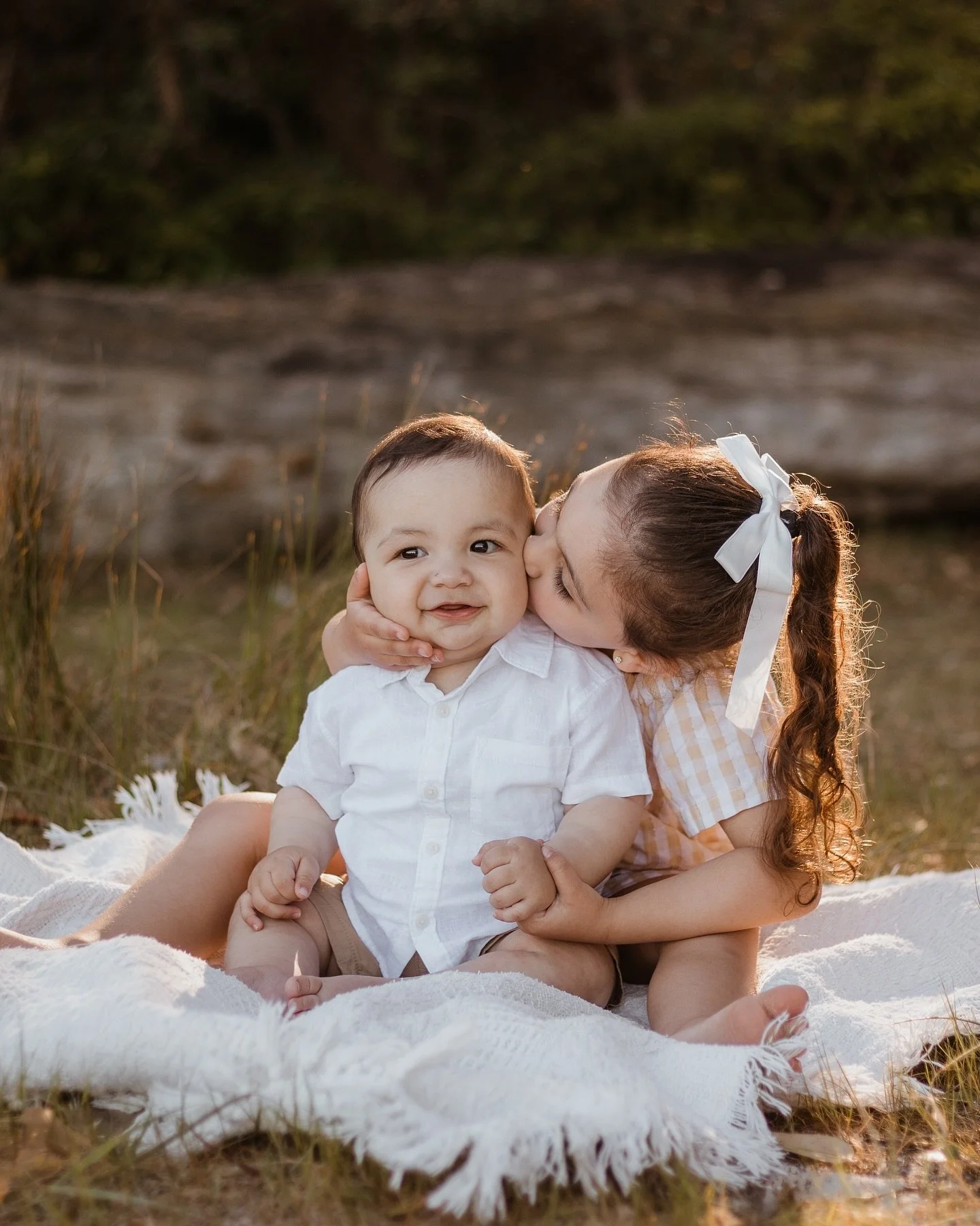 These two 🥹 the hand holding and hand on her little brothers squishy face! The cutest! x
