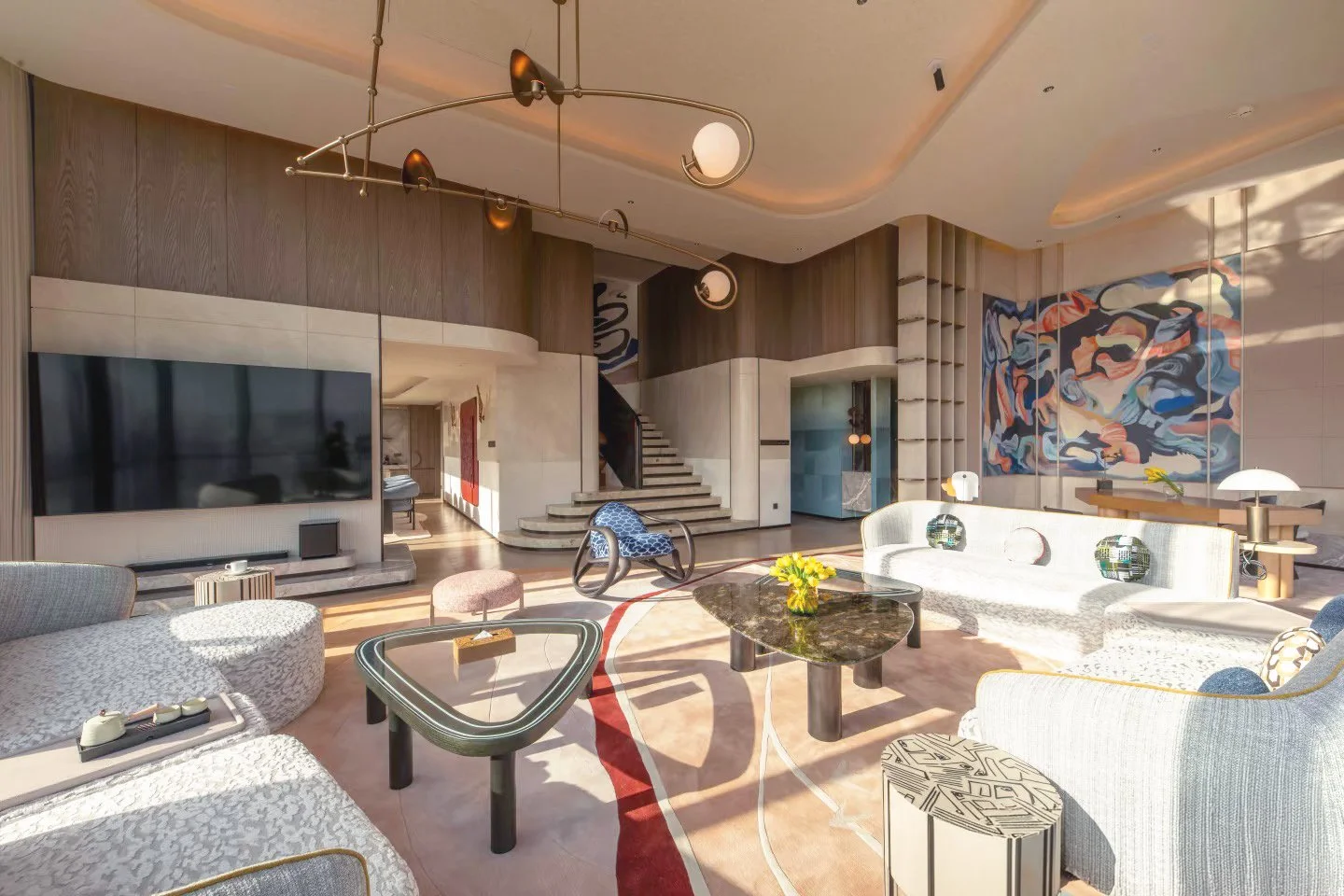 A luxurious hotel suite in Hotel Indigo Xi'an, filled with designer furniture and art