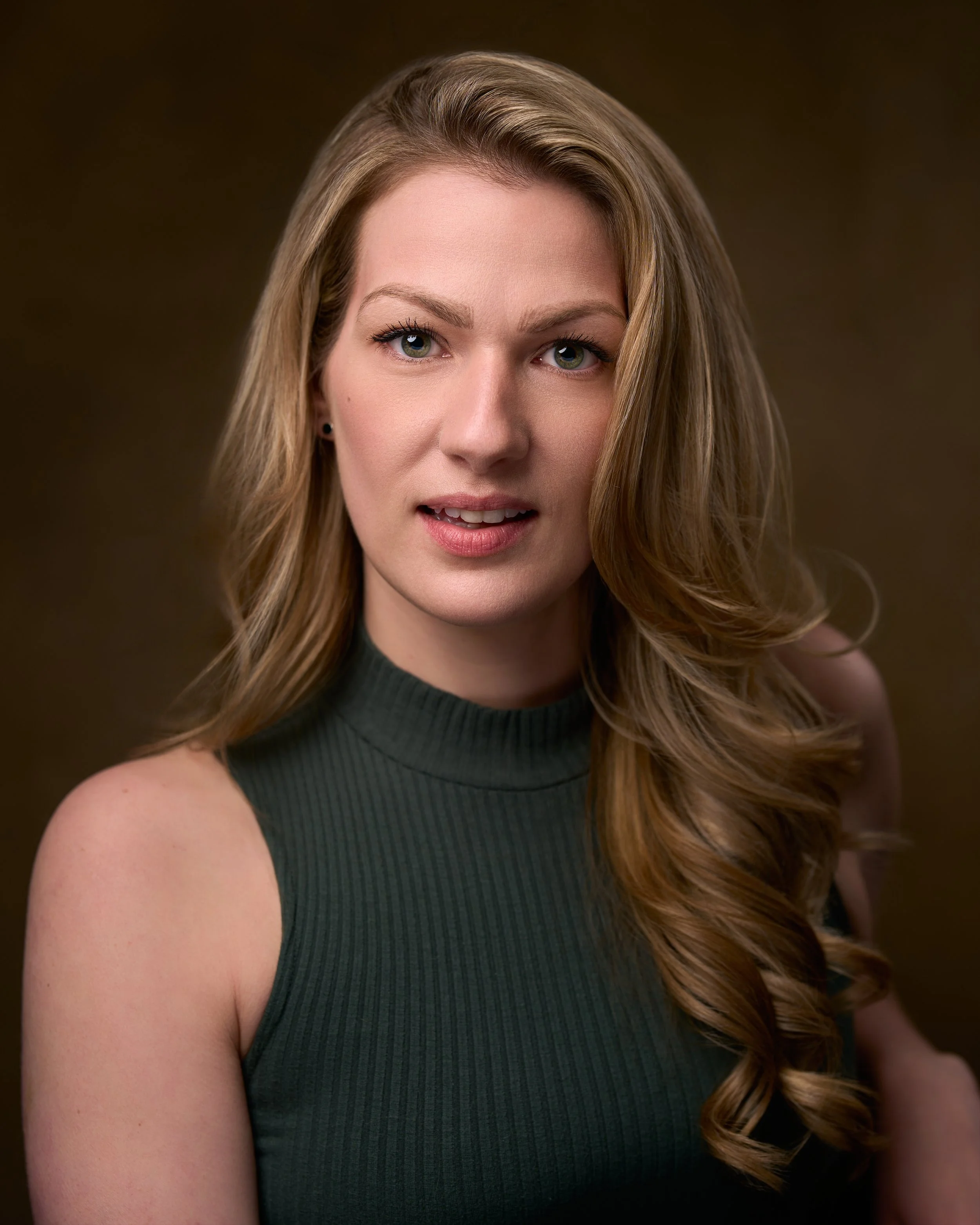 Professional female acting headshot that showcases confidence, personality, and versatility.