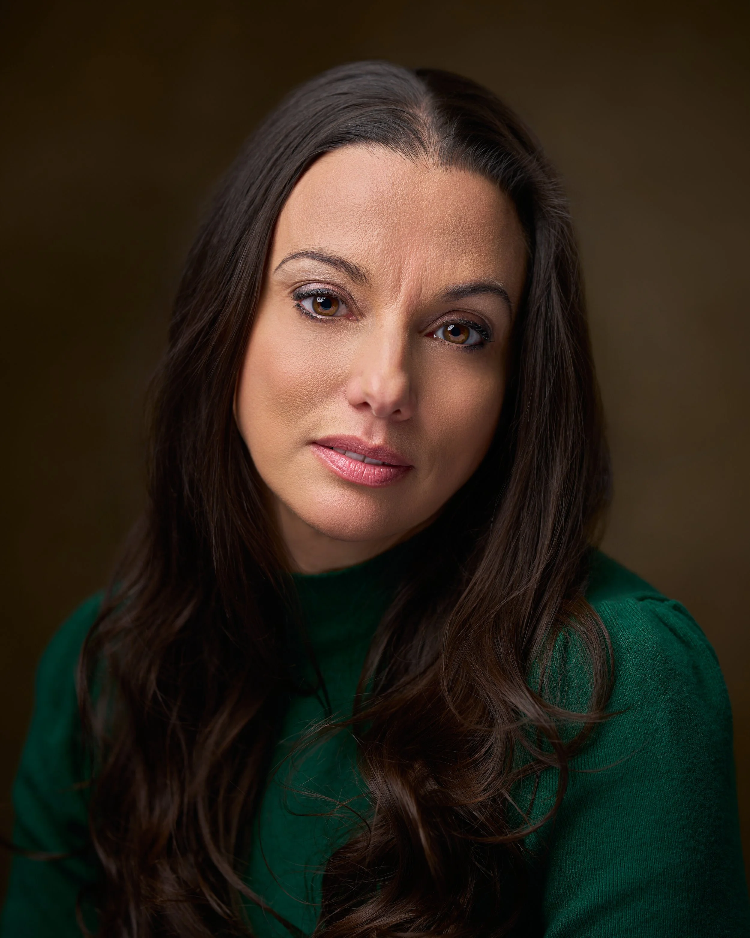 Professional female acting headshot with natural studio lighting