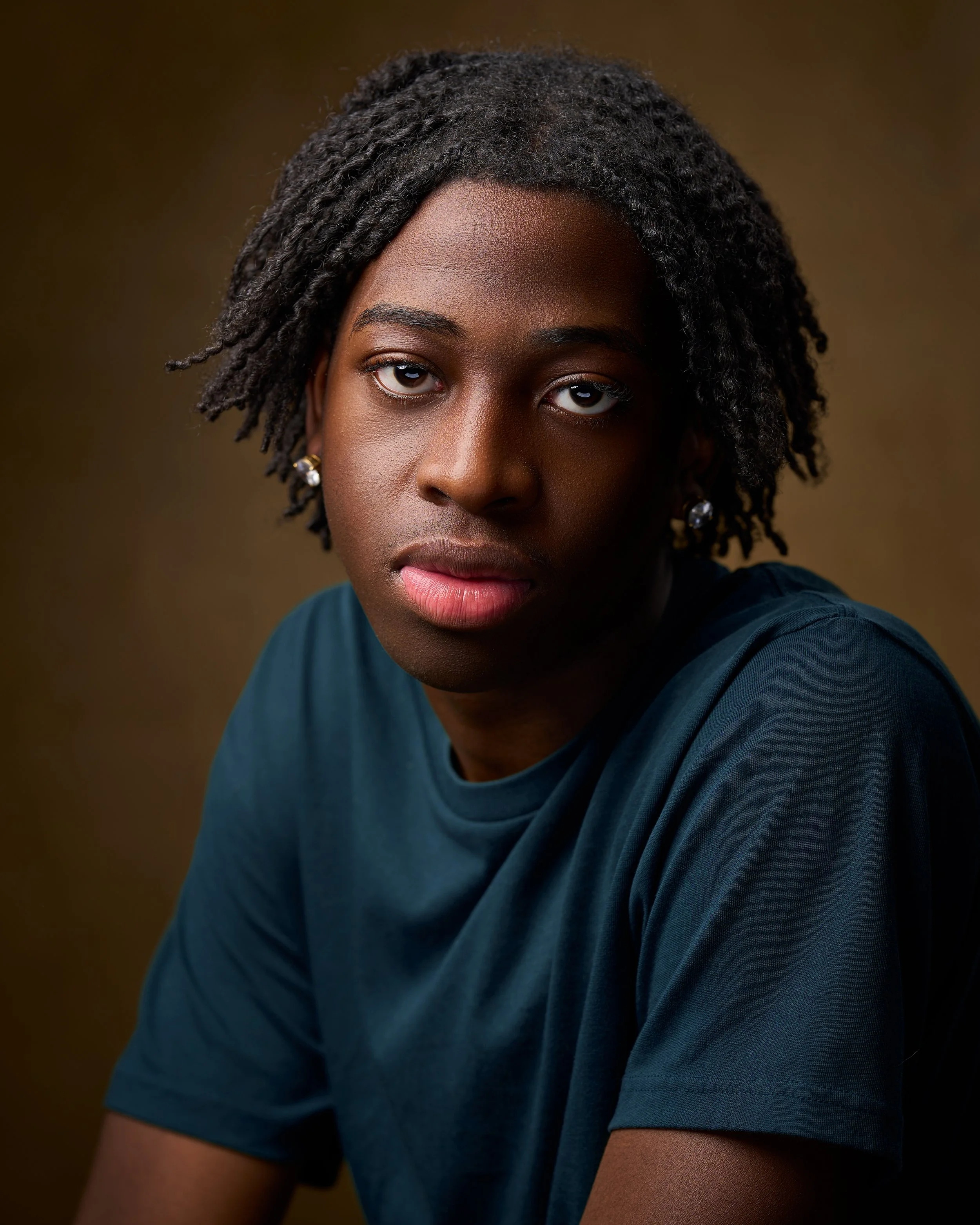 Relaxed acting headshot with a modern, cinematic feel.