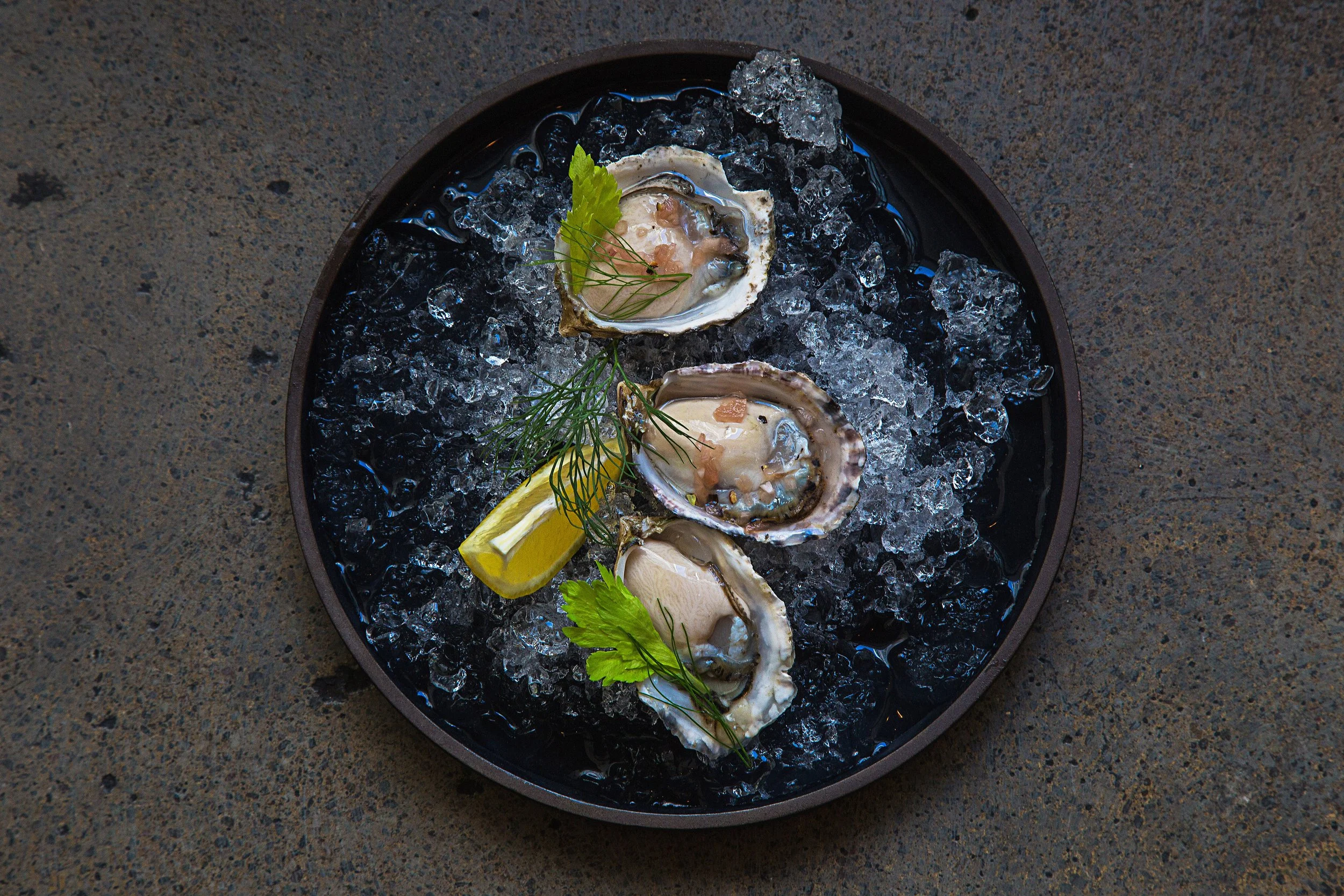 Fresh oysters on the half shell, served chilled with house-made mignonette, lemon wedges, and cocktail sauce. Bright, briny, and refreshingly clean.
