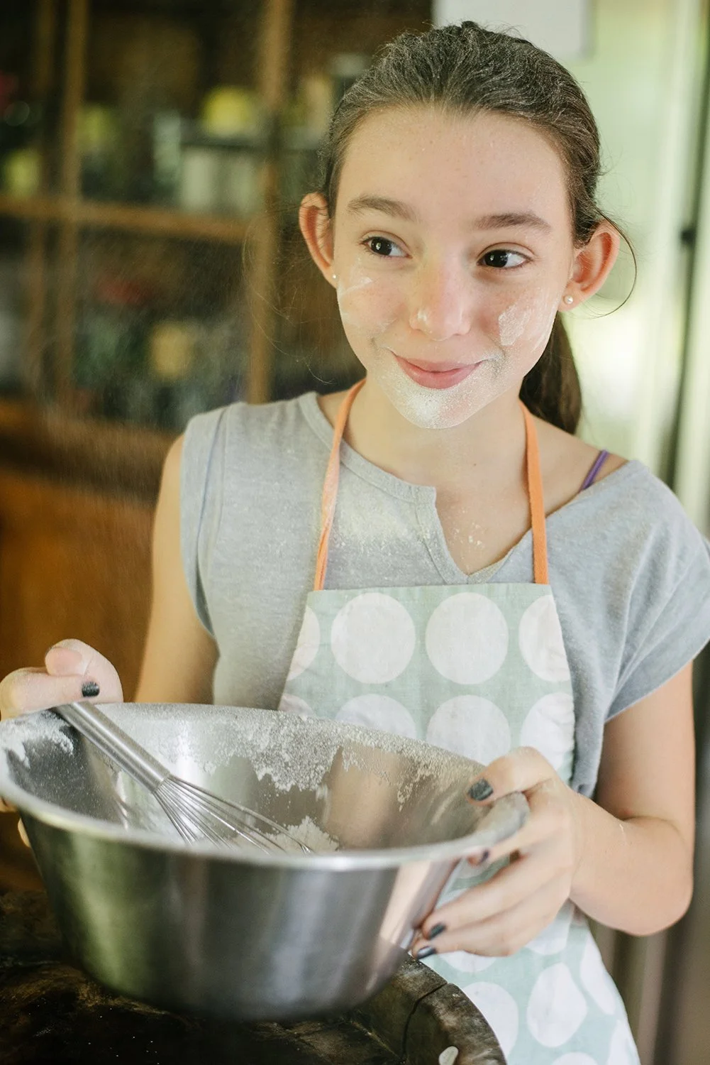 Child in the kitchen, family photography by Suki Zoe