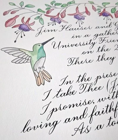 close up of watercolor fuschia flowers and a hummingbird on a calligraphy Quaker marriage certificate