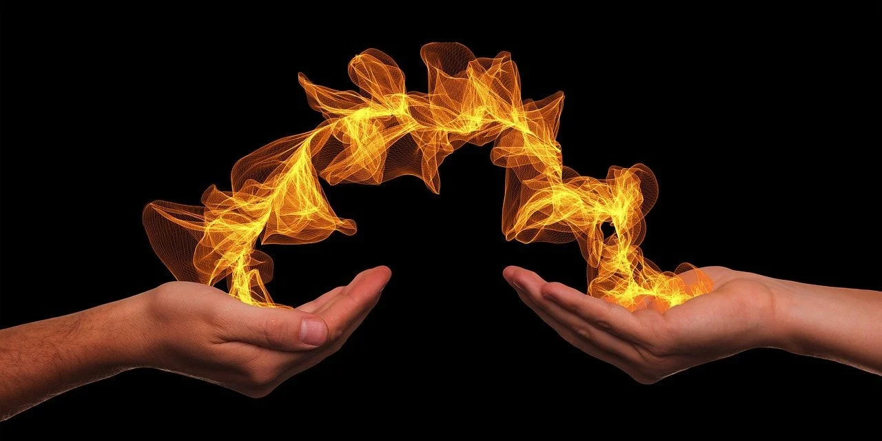 Two hands channeling fire energy