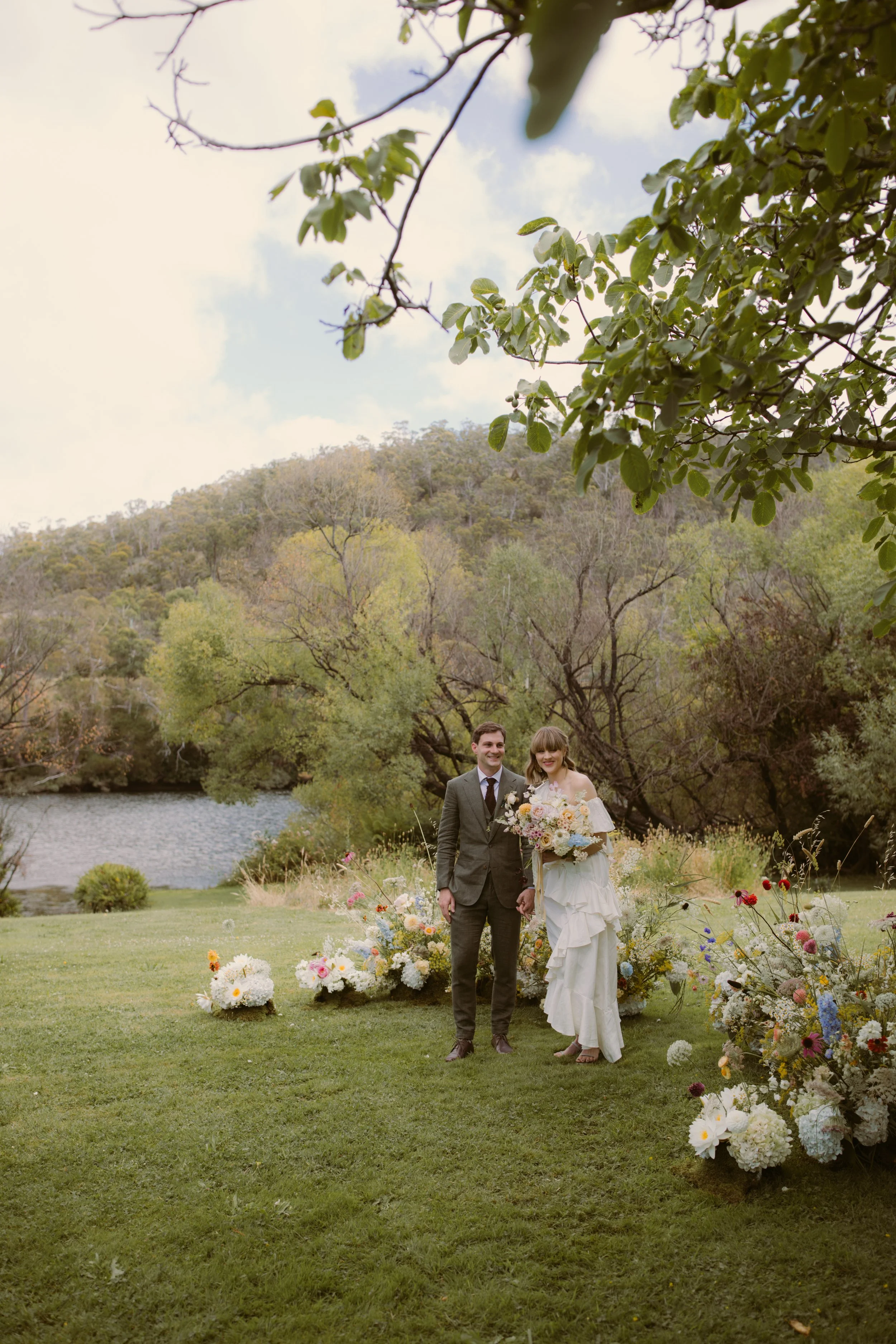 Romantic garden-style bridal bouquet featuring locally sourced Tasmanian flowers, ceremony arrangement, stunning garden flowers in a fairy ring