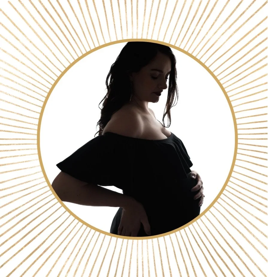 An artistic image of a silhouette of an expectant mother in a round gold frame.