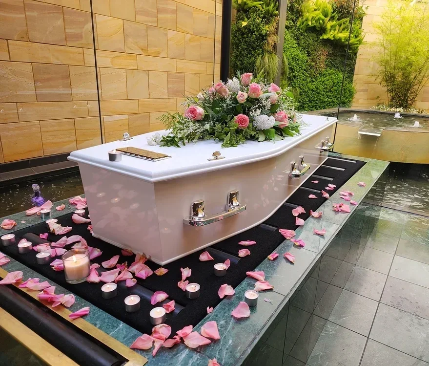 Coffin with flowers in Adelaide chapel for a Reflections Funeral Service by Embrace Funerals