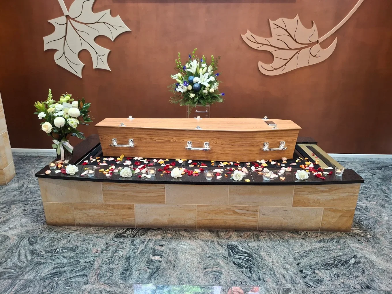 Coffin and flowers in an Adelaide chapel for a classic funeral service by Embrace Funerals
