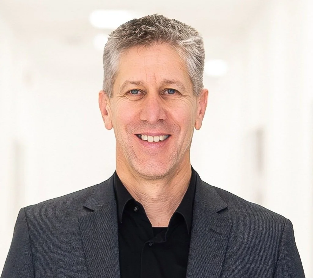 Werner Gangl, SVP at Sony DADC looking into the camera, wearing a black suit