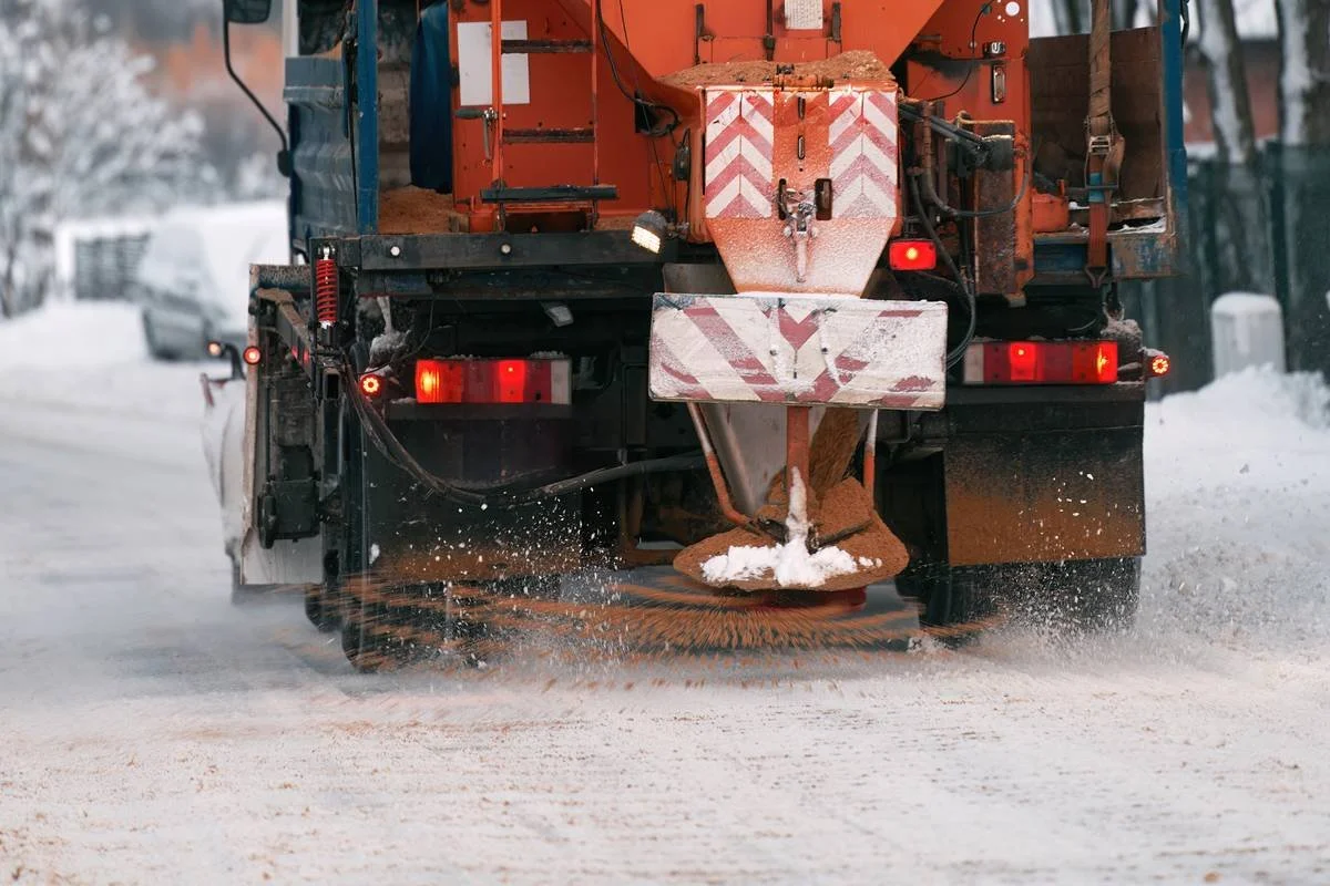 A real salt spreader in action. It’s on a parking lot, so it reads a little like a city truck. The alternate shows salt on a wet parking lot.