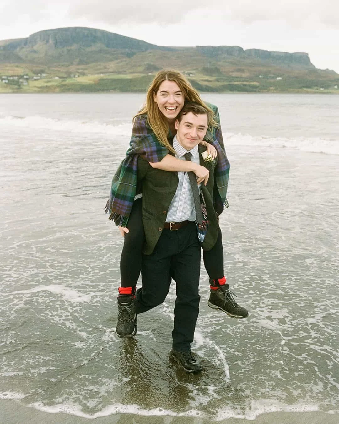 Bride and groom enjoy their love on the beach during their Isle of Skye elopement