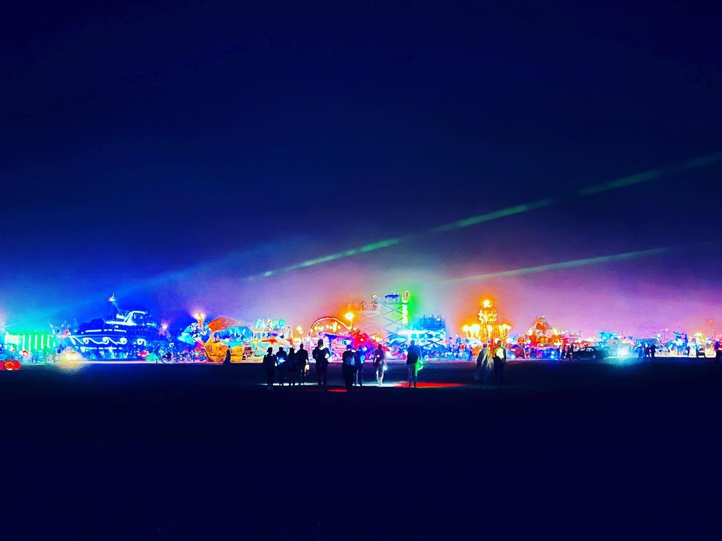 These lights are blinding my eyes. People pushing by, walking off into the night. ✨✨✨#burningman #neonlights #anotheronebitesthedust