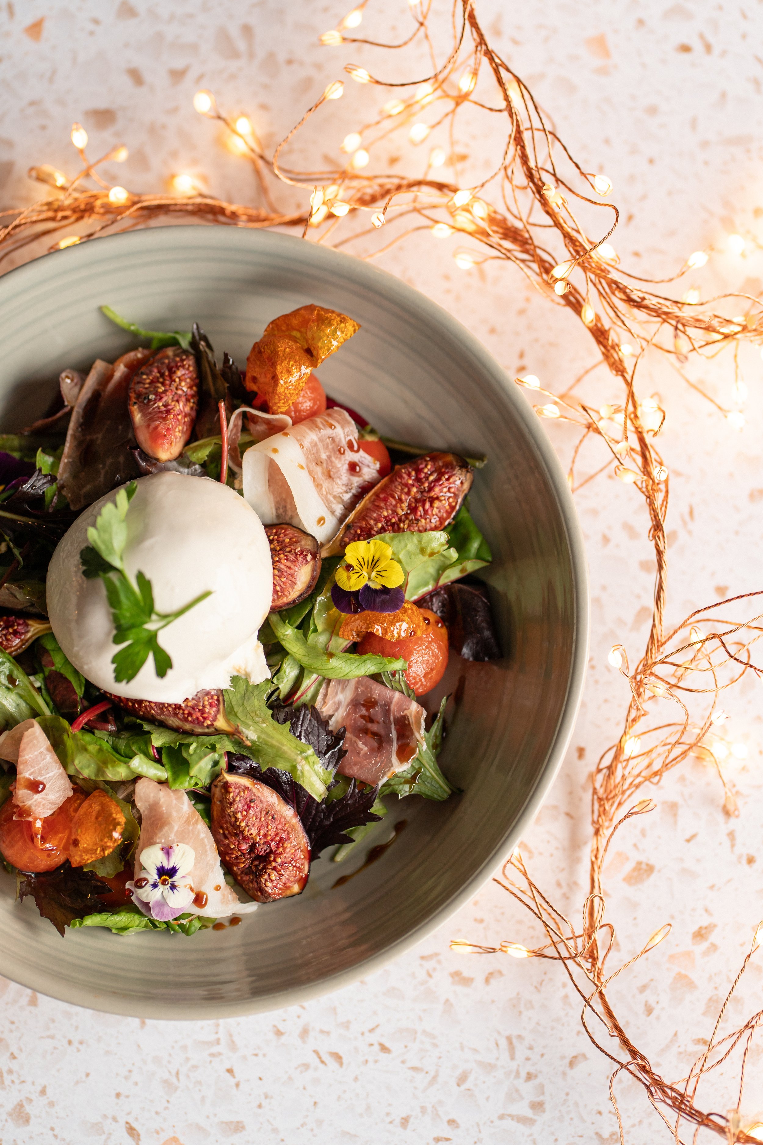 Roasted Fig, Burrata & Prosciutto Salad
New Leaf Urban fresh Salad Leaves served with Burrata Cheese, Cherry Tomatoes, Prosciutto & a drizzle of Amodeo Balsamic Reduction
