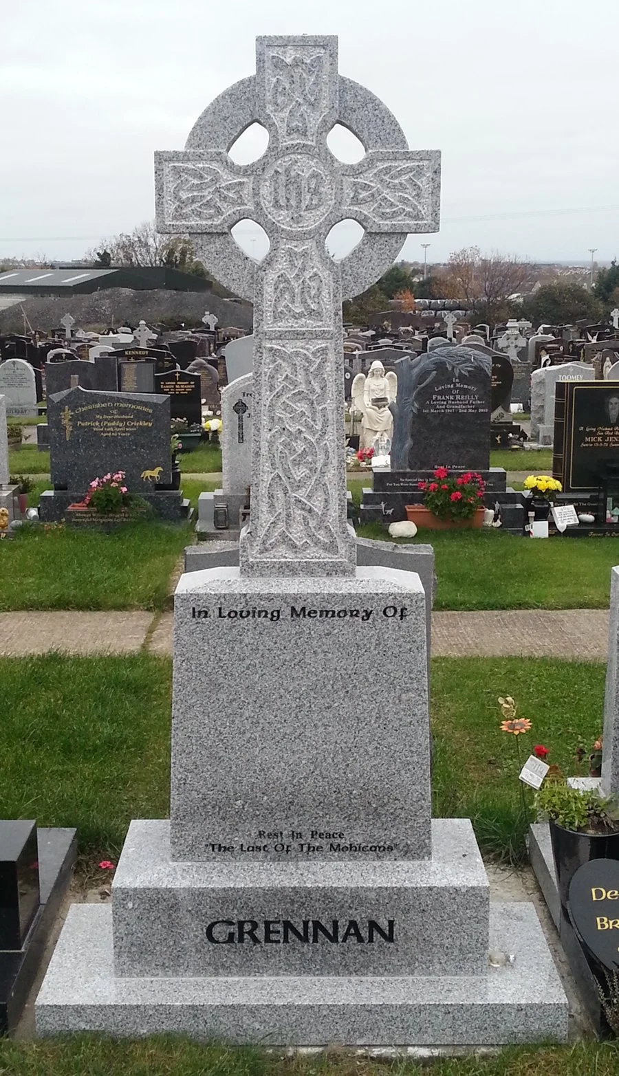 Gravestone with Celtic cross design, inscribed with 'In Loving Memory Of GRENAN'.
