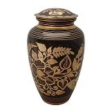 Decorative vase with gold floral pattern on black background.