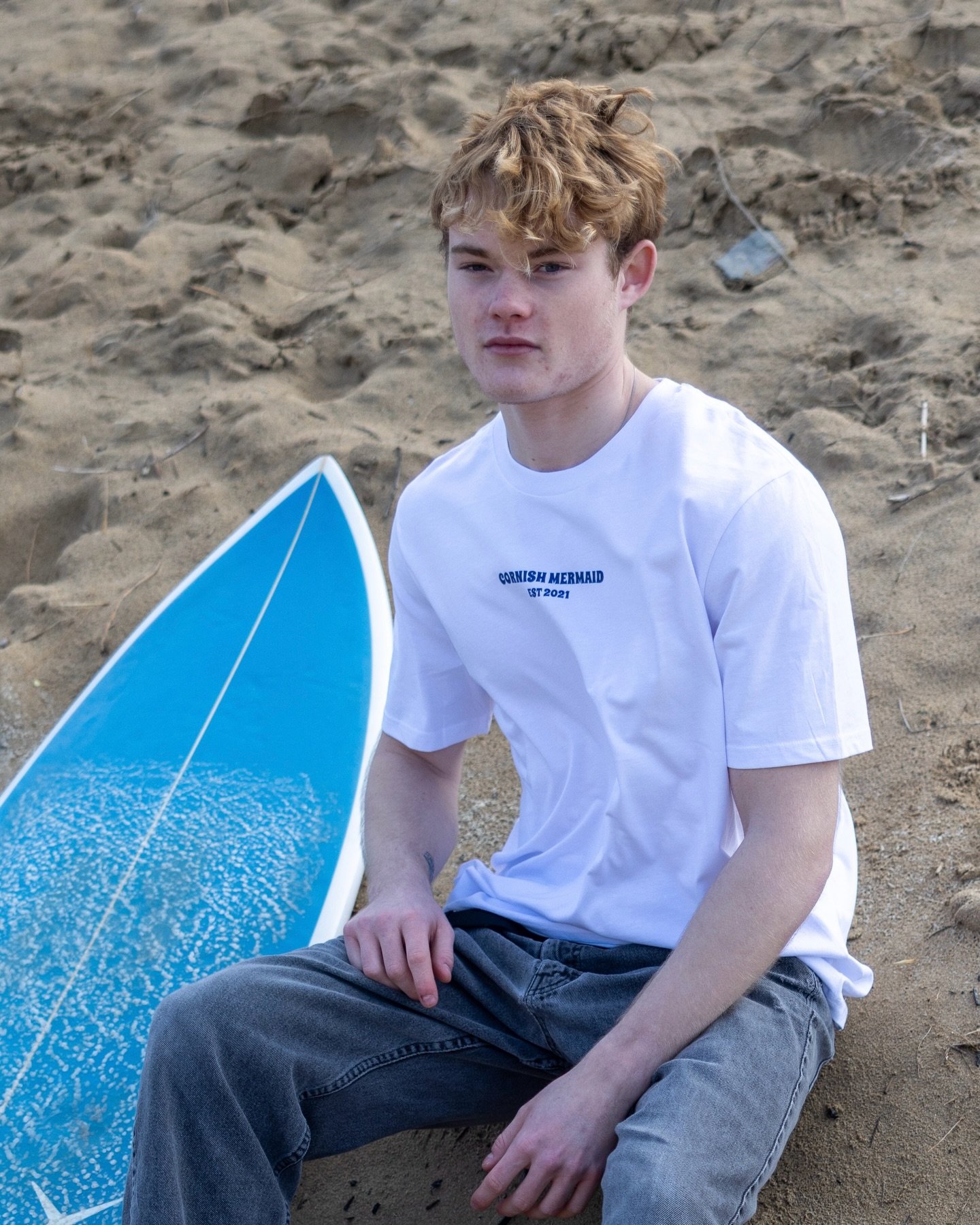 Board in the sand. Slow, salty afternoons. That easy Cornish Mermaid state of mind 🏄🏼&zwj;♂️

Nothing over the top - just clean lines, soft 100% organic cotton, and that subtle &lsquo;CORNISH MERMAID EST 2021&rsquo; detail that says it all. 

Charl