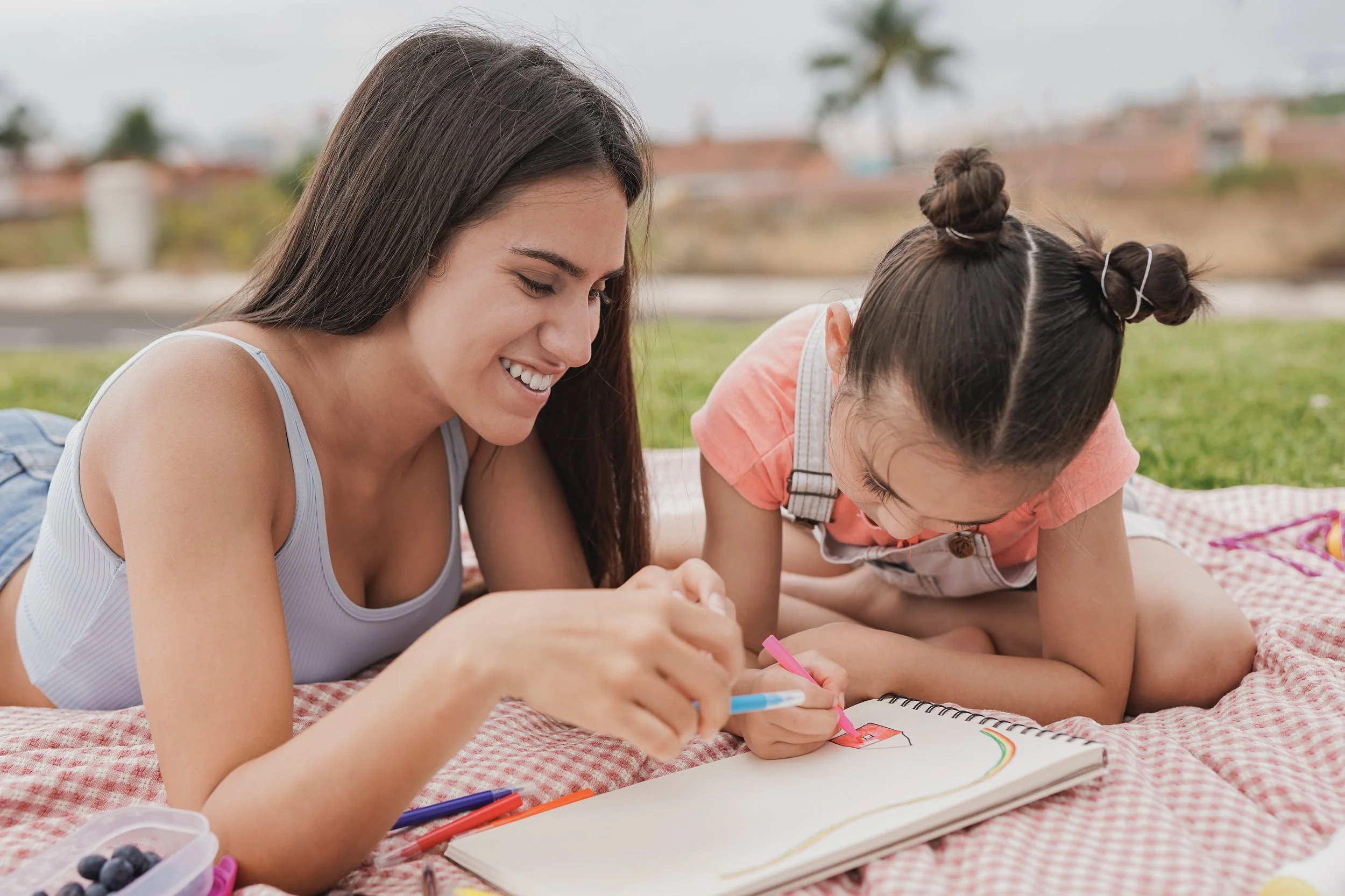 teenage-girl-enjoy-day-with-little-sister-at-park-2026-01-08-22-01-09-utc.jpg