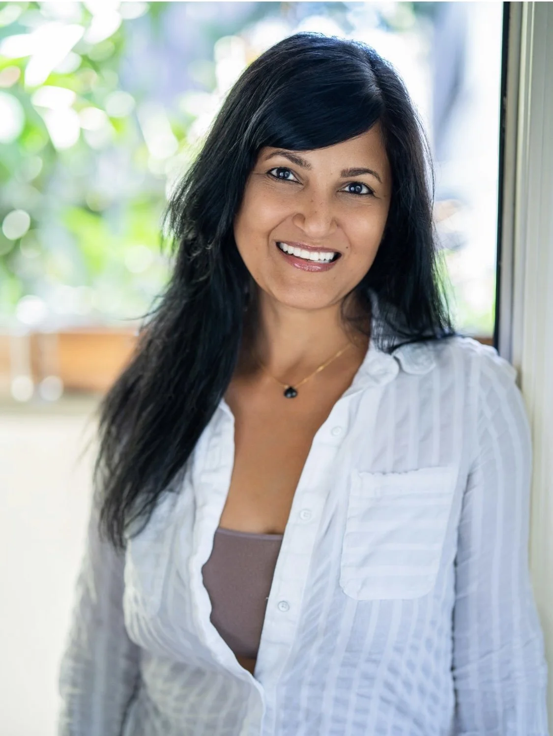 Kanan Kapila welcoming participants at a wellness event at Loopwell in Montclair