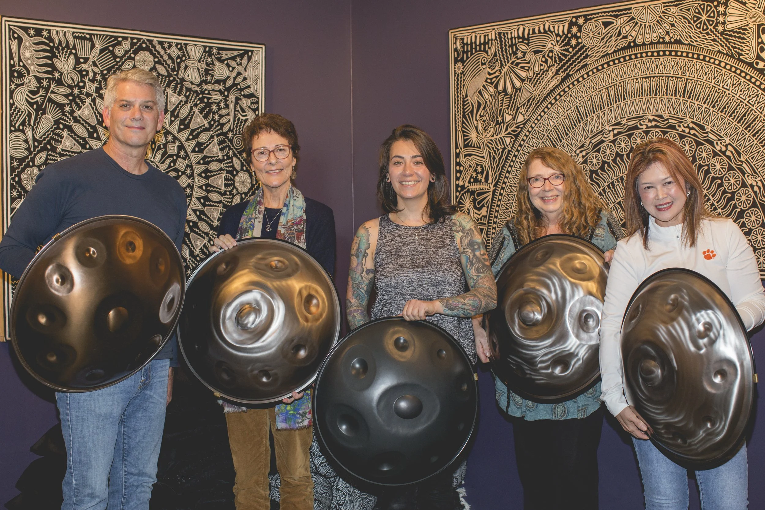 People holding handpan