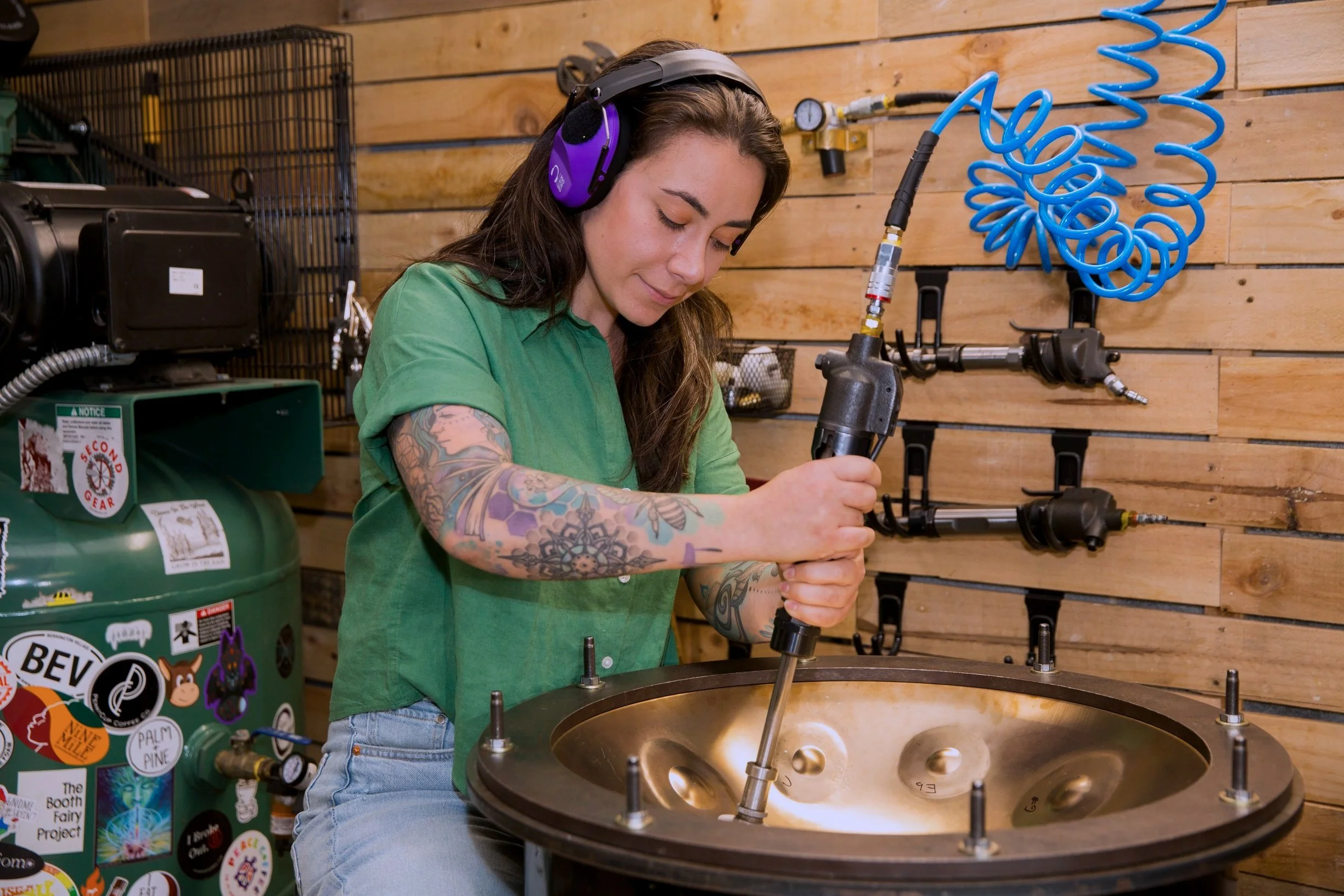 Rebecca shaping a handpan