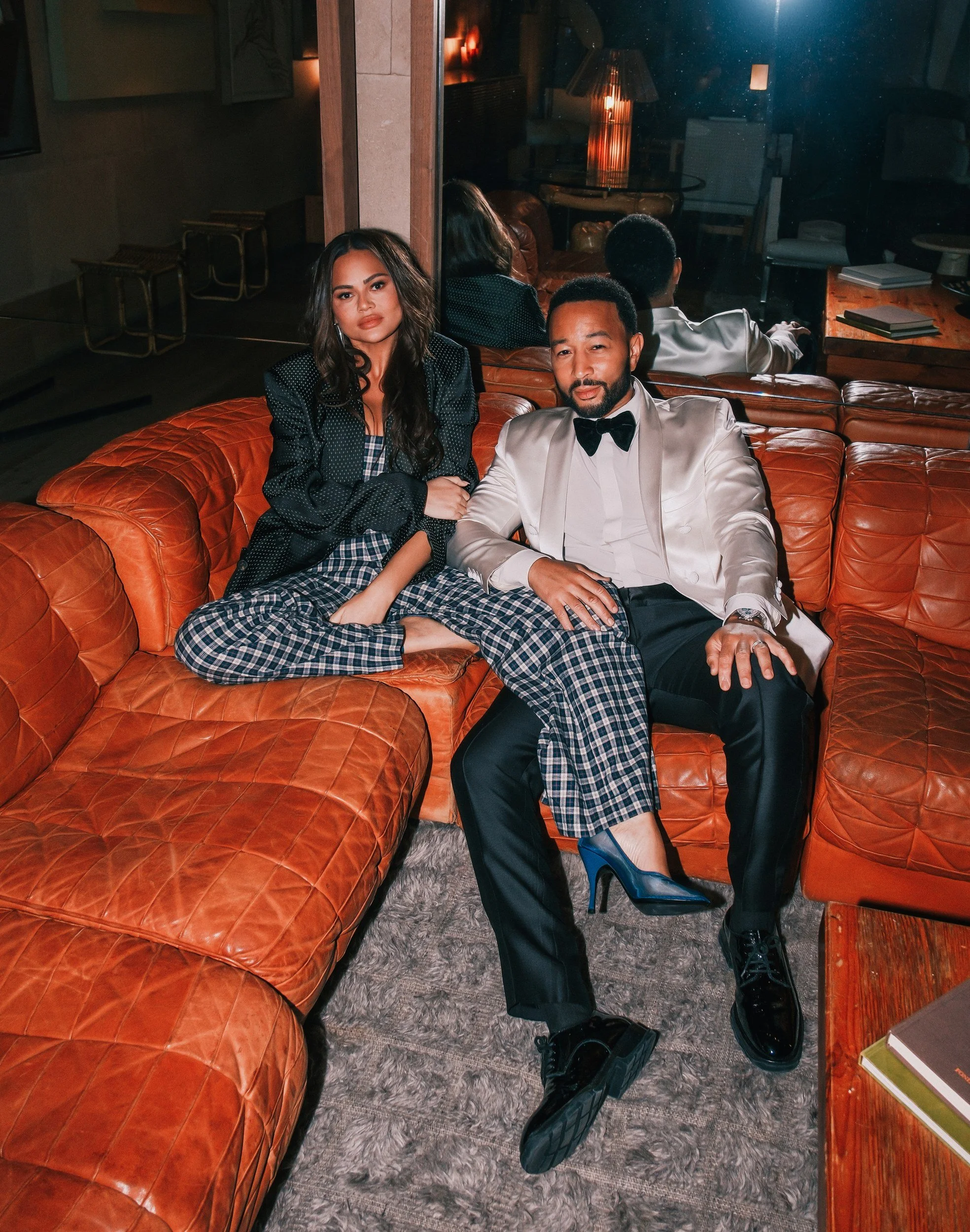 John Legend with a guest on a leather sofa at Santa Monica Proper