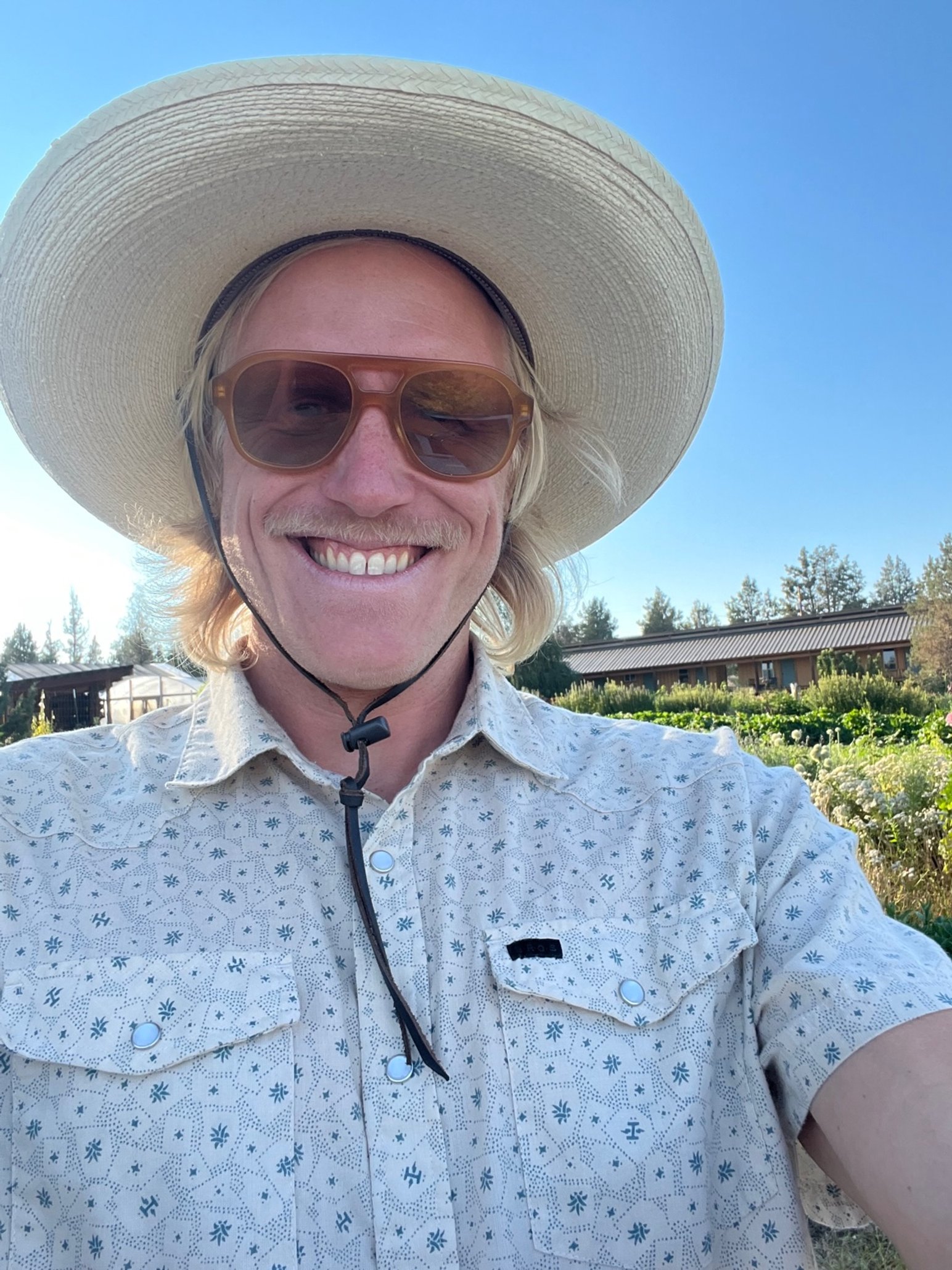 Dj Cevicii with sunhat at rainshadow organics at wedding in oregon